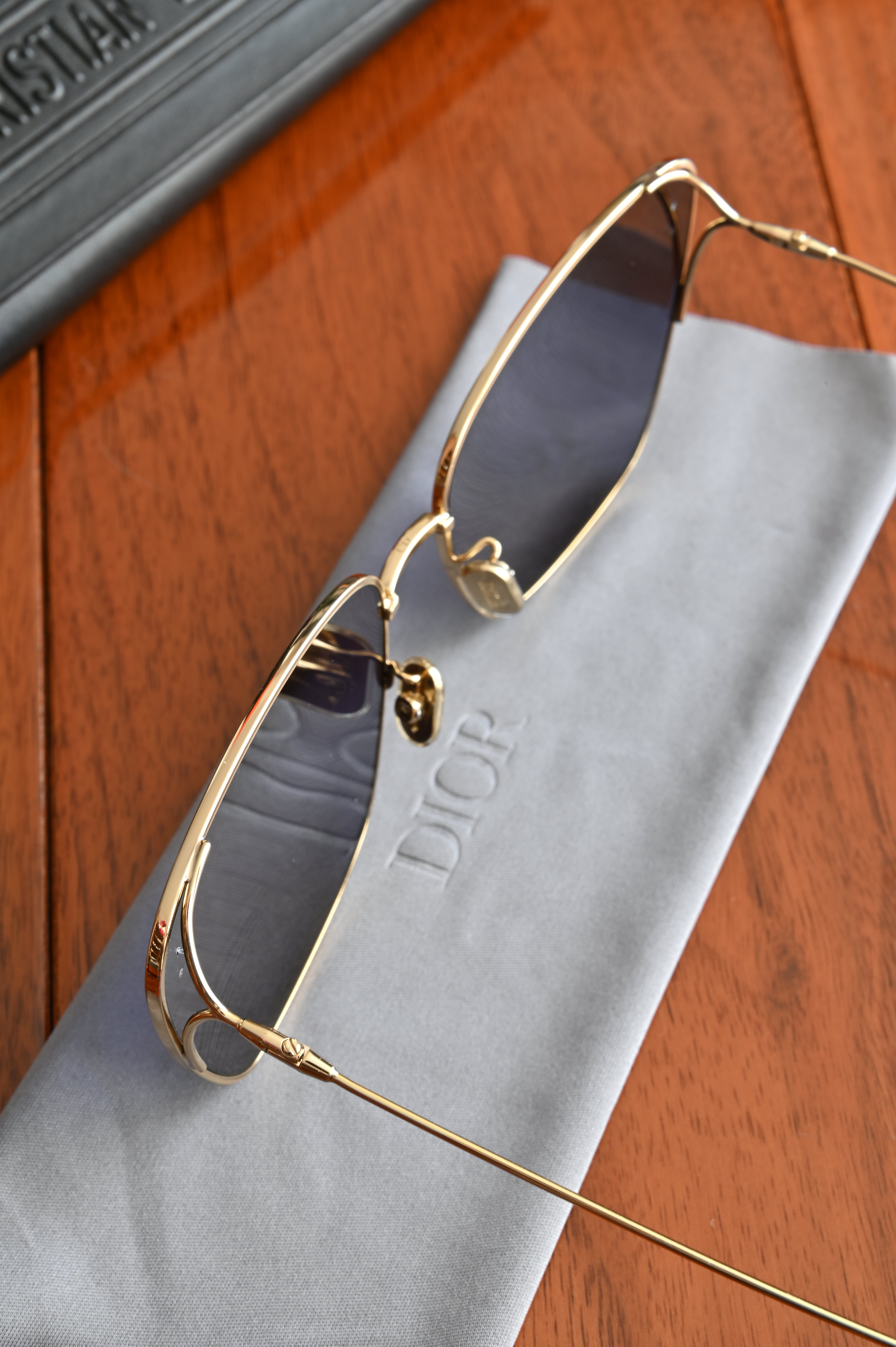 Christian Dior Stellaire 1/S square sunglasses in gold-finish metal close up