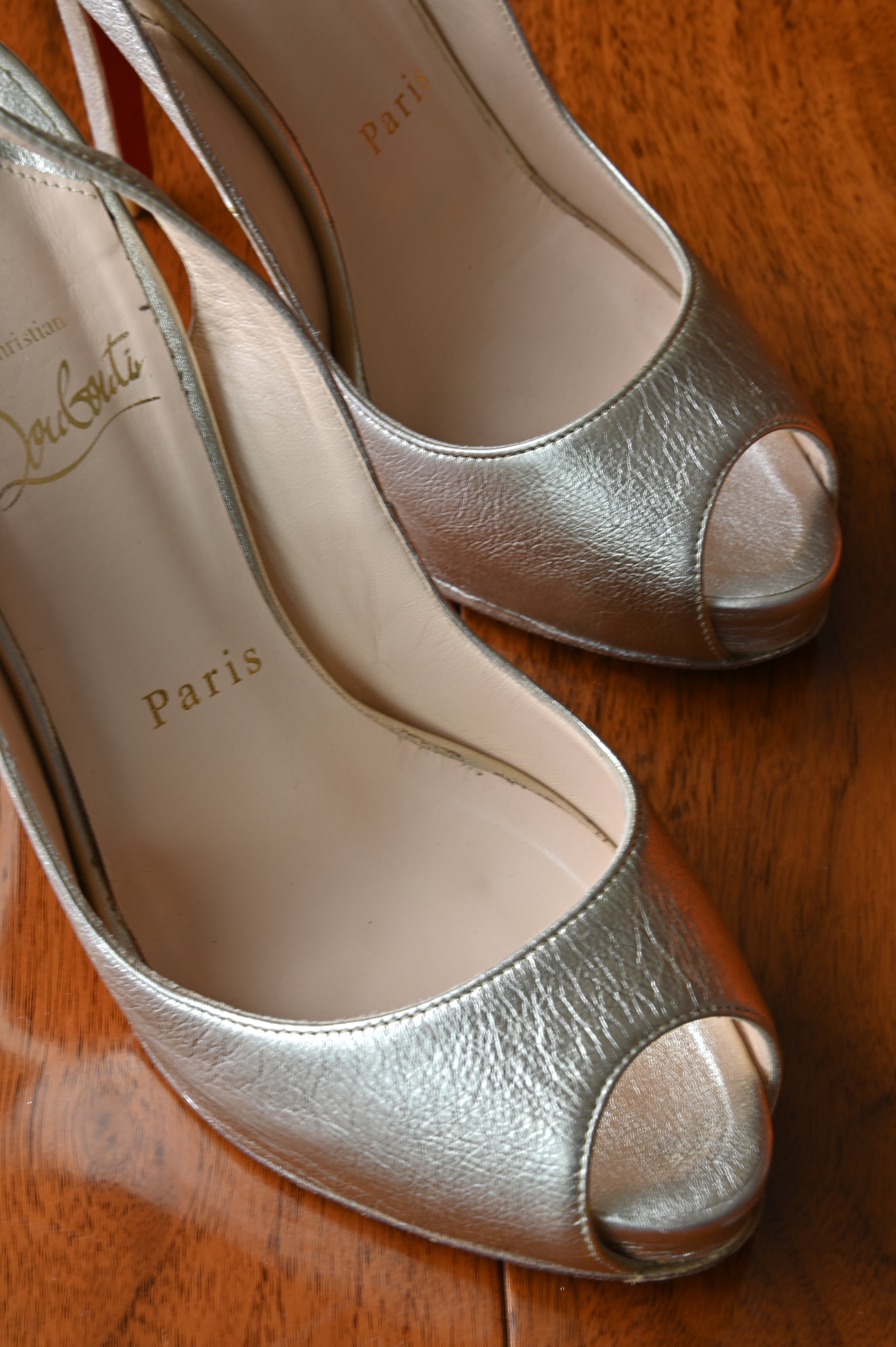 Christian Louboutin Silver Metallic Leather Slingback Pumps front