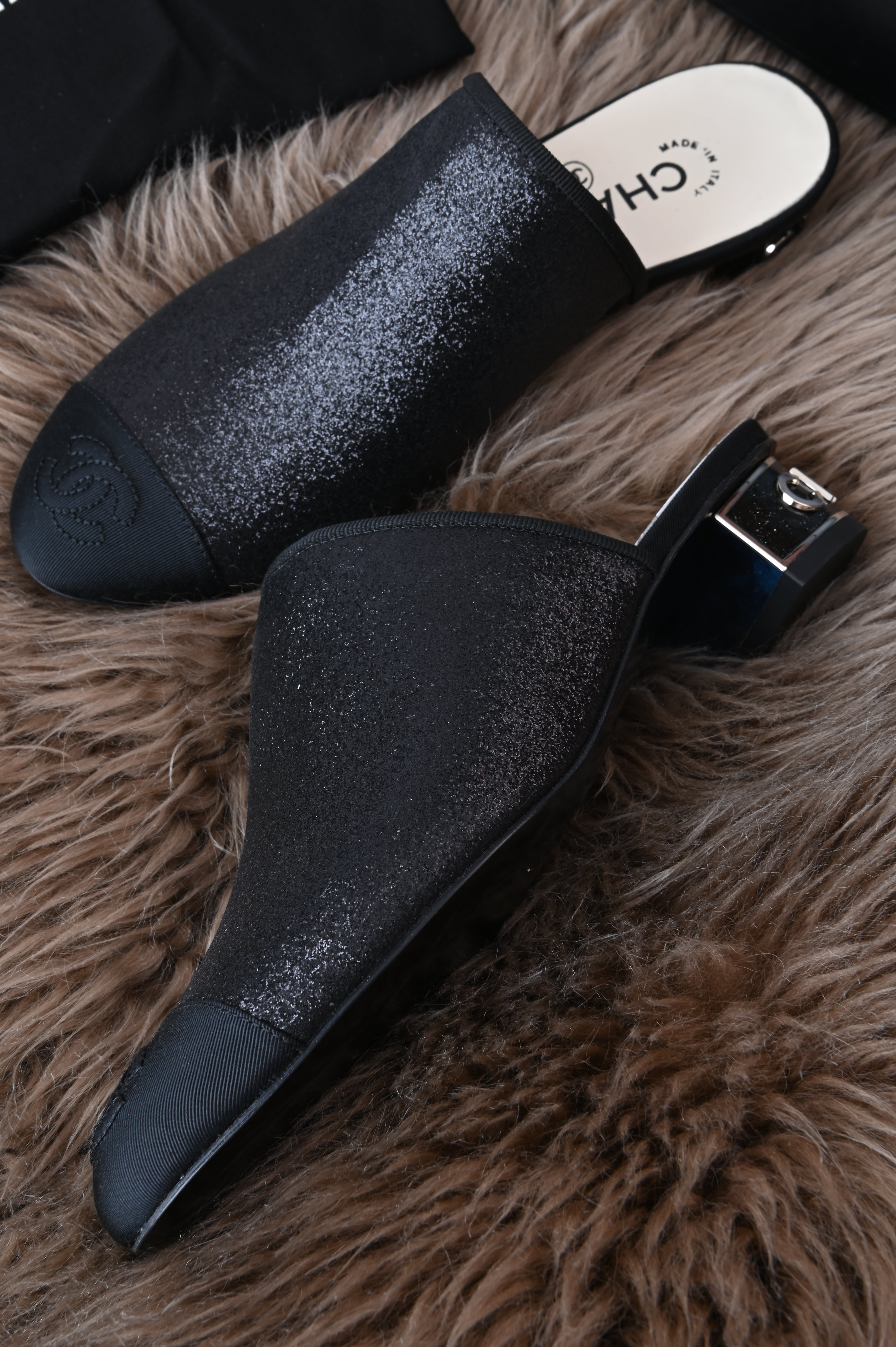 Chanel mules in glittery black