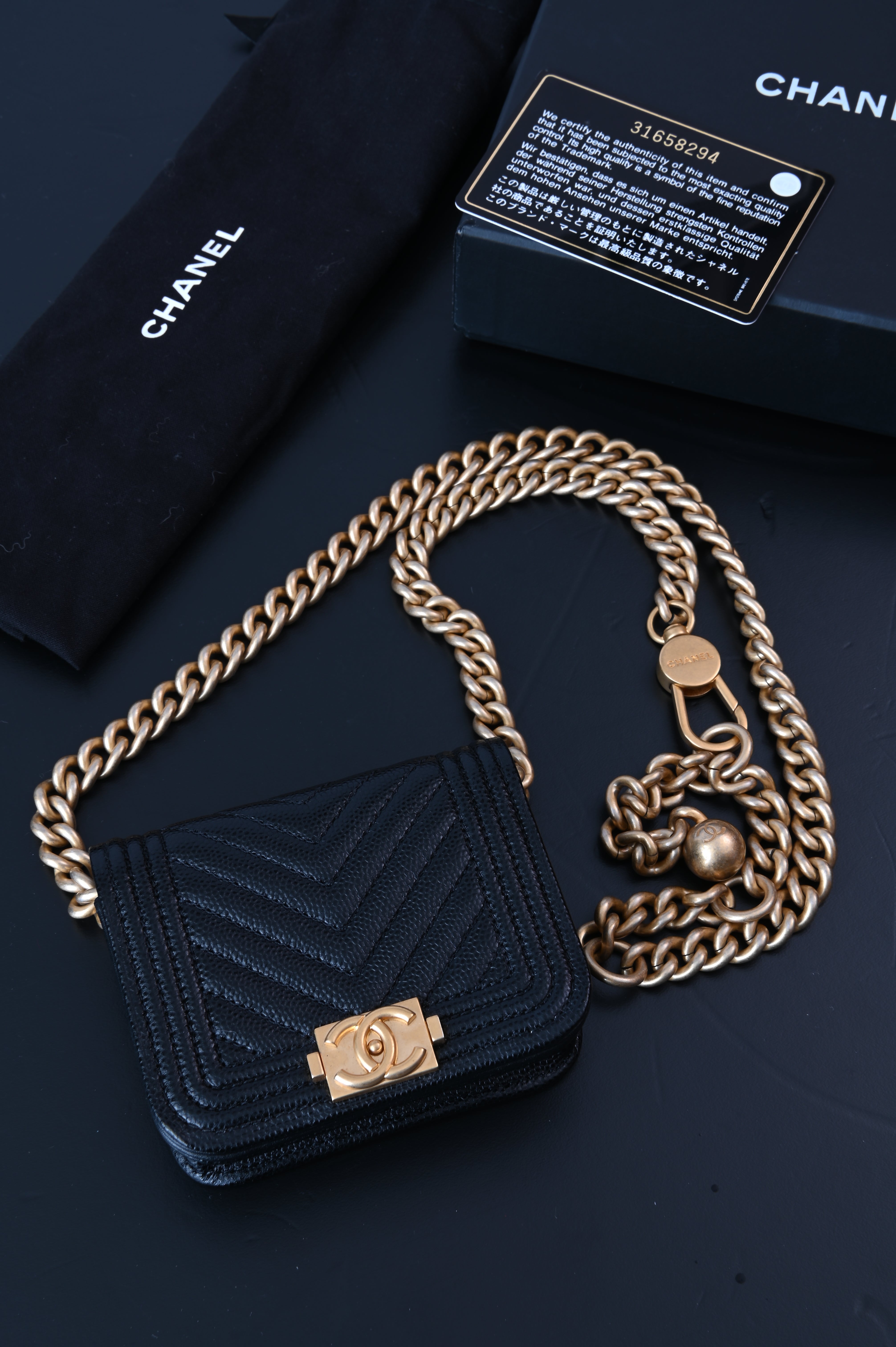Chanel Boy flap belt bag in caviar leather and gold hardware