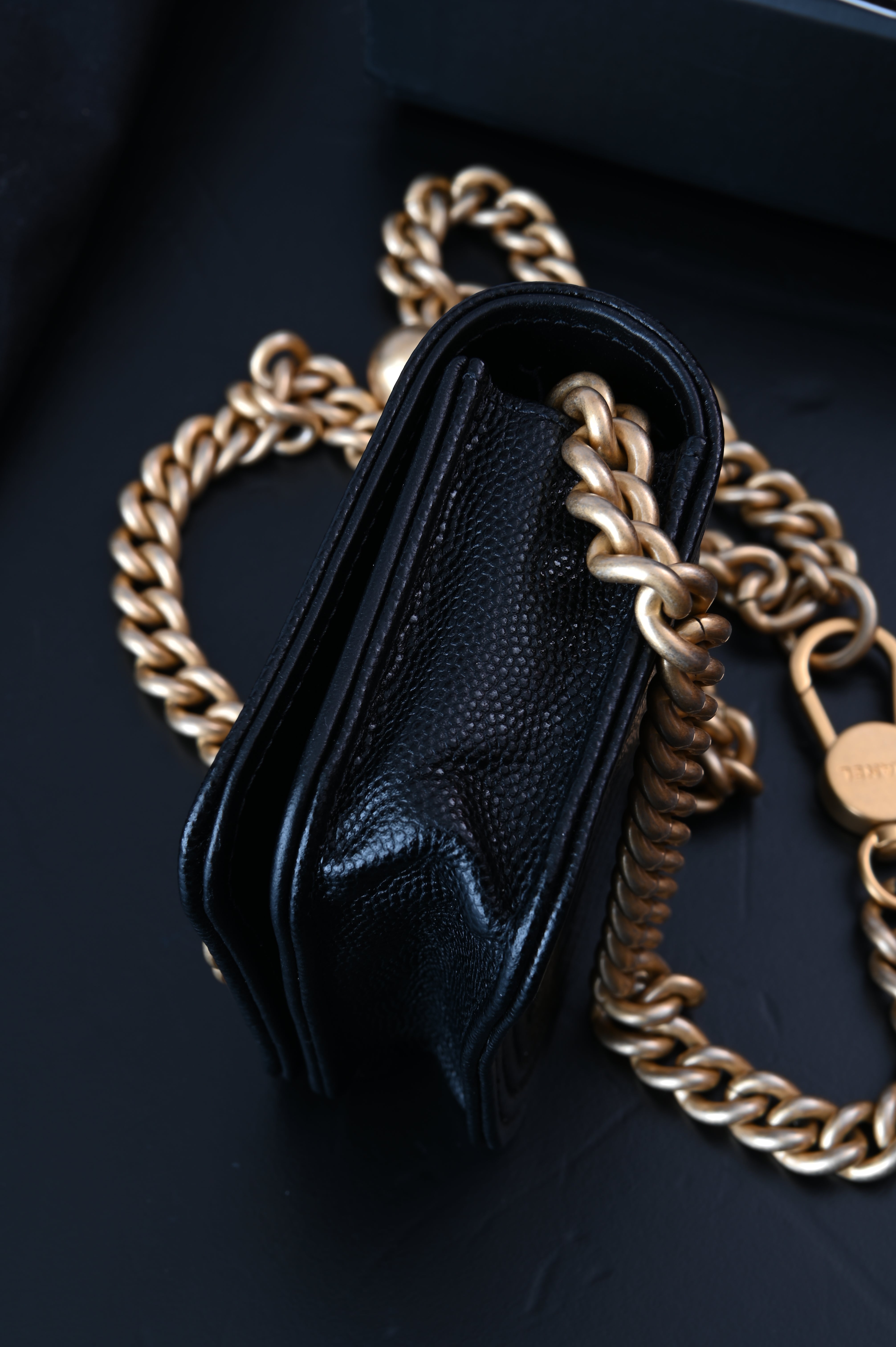 Chanel Boy flap belt bag in caviar leather and gold hardware