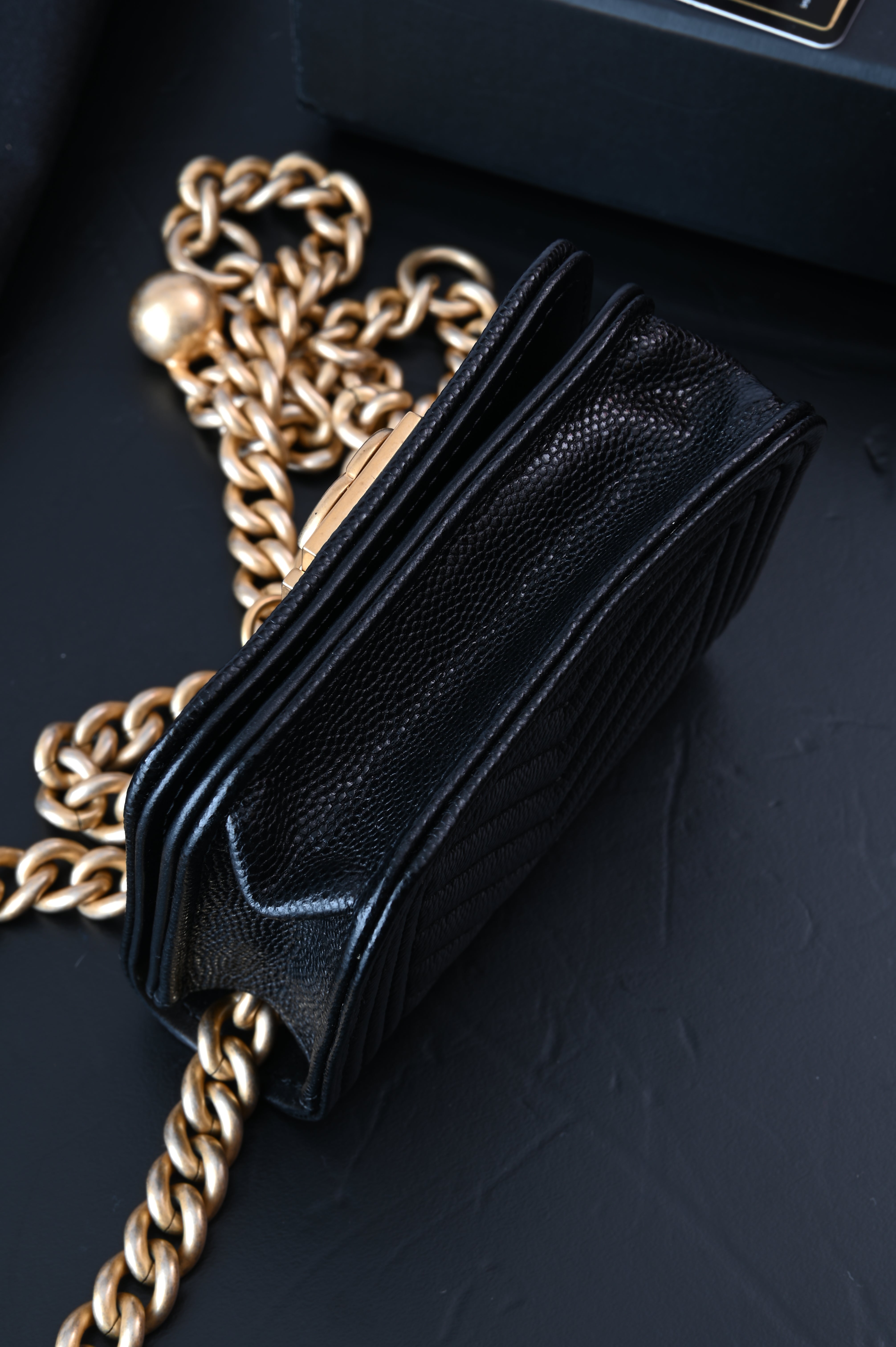 Chanel Boy flap belt bag in caviar leather and gold hardware