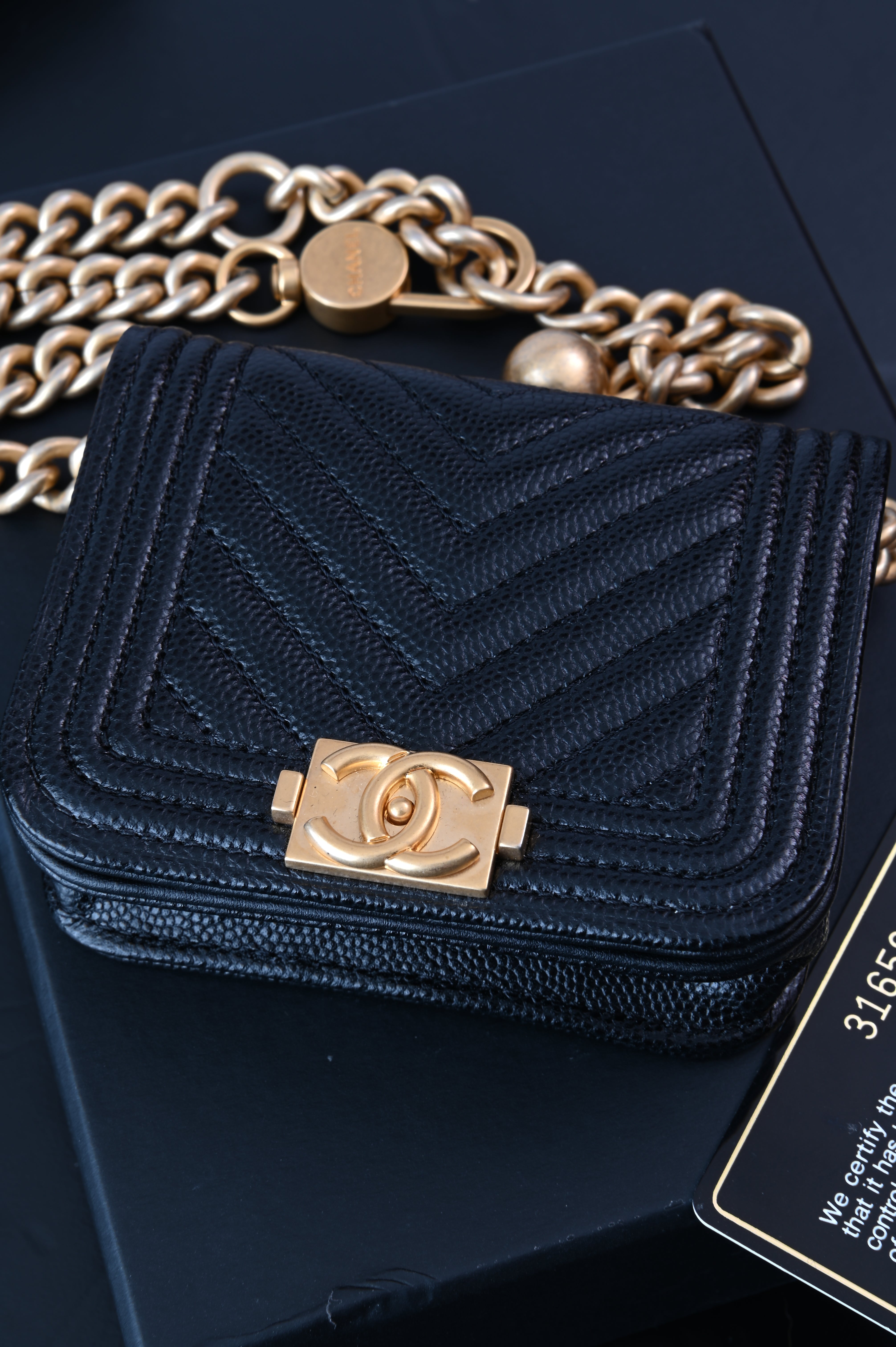 Chanel Boy flap belt bag in caviar leather and gold hardware