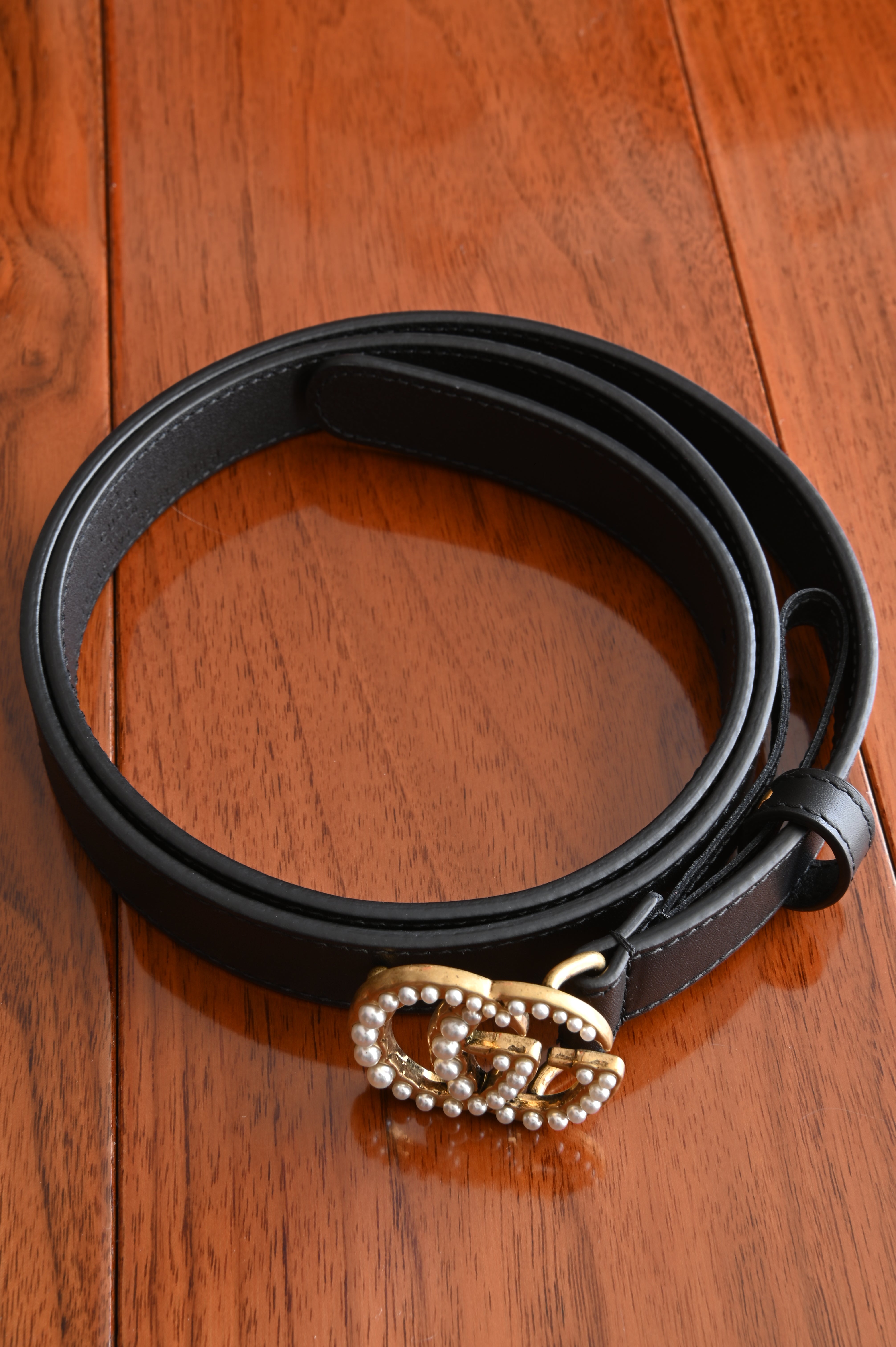 Gucci GG belt with pearl in Gold hardware and black calf angle two