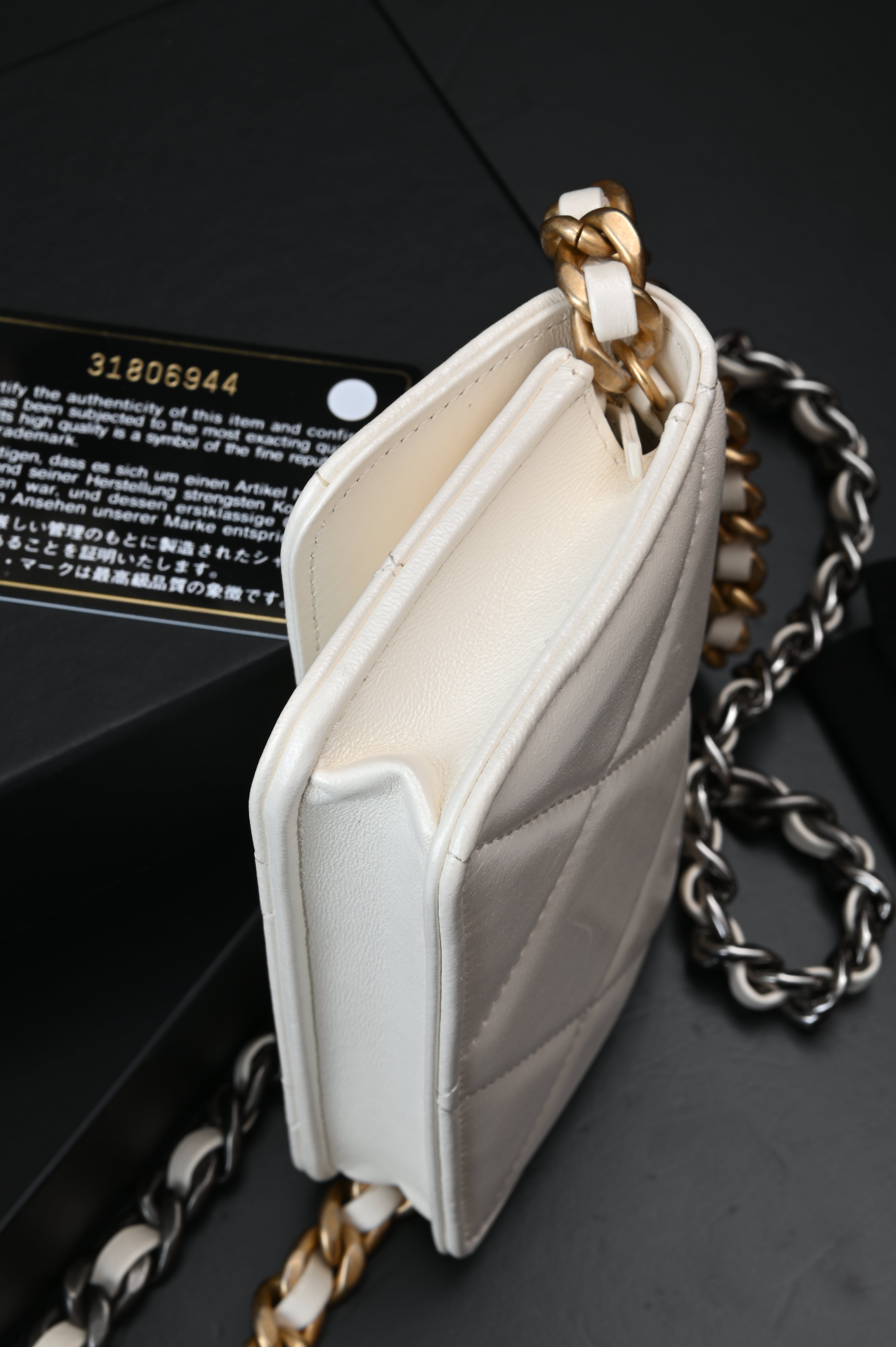 Chanel White Quilted Lambskin Chanel 19 Flap Clutch Gold and Ruthenium Hardware, 2021
