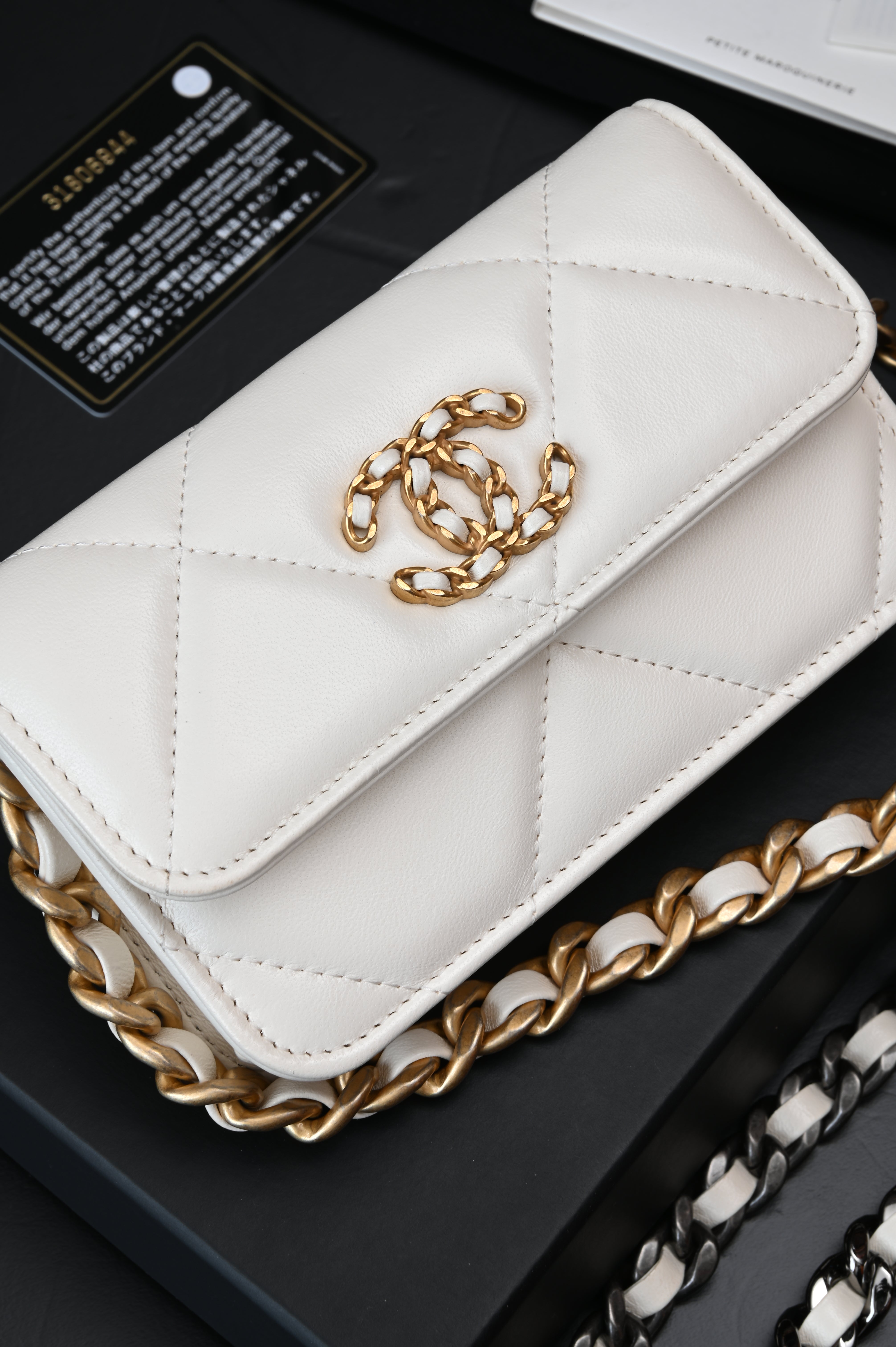 Chanel White Quilted Lambskin Chanel 19 Flap Clutch Gold and Ruthenium Hardware, 2021
