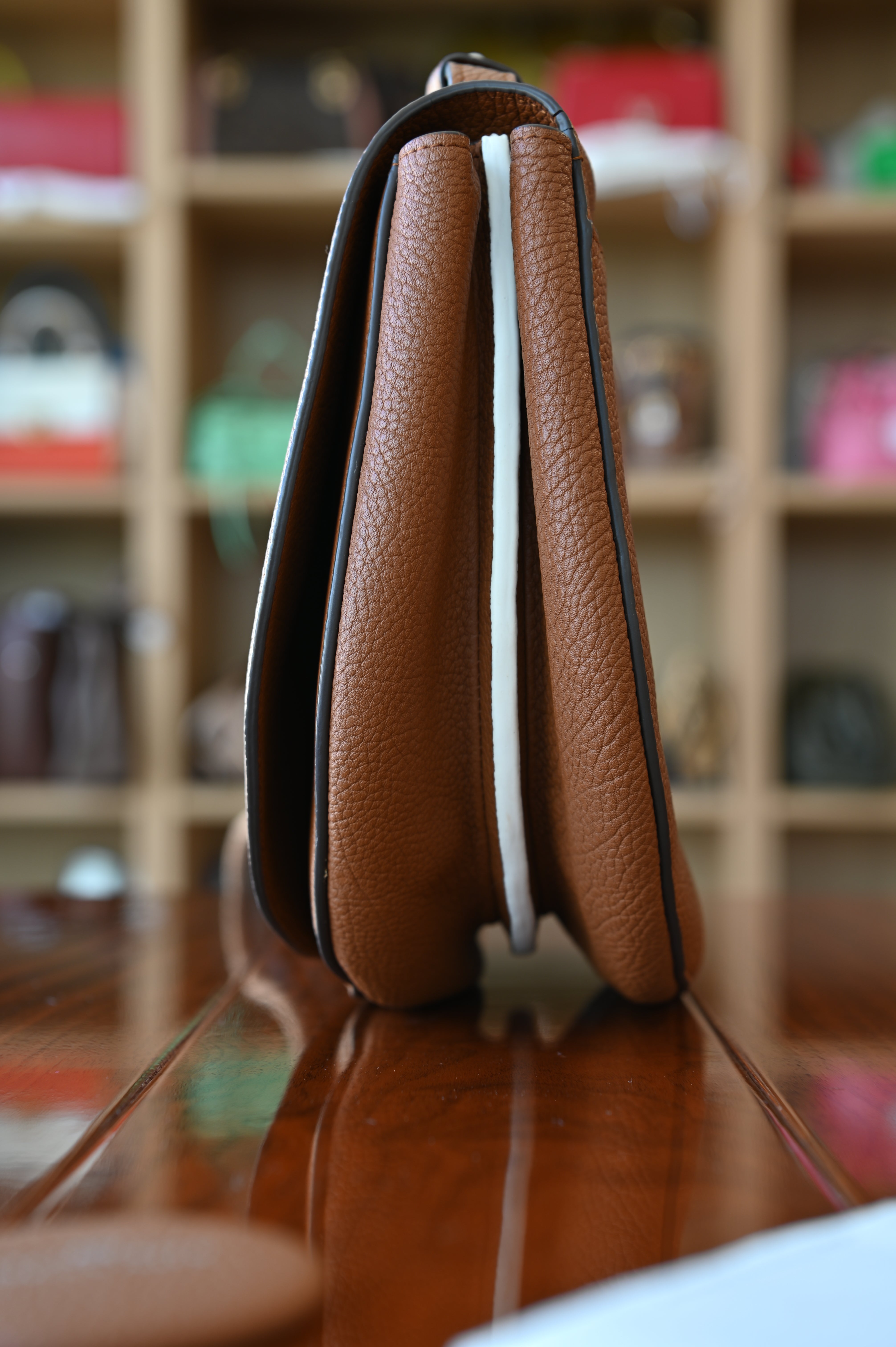 Delvaux Le Mutin Brown Saddle Bag side