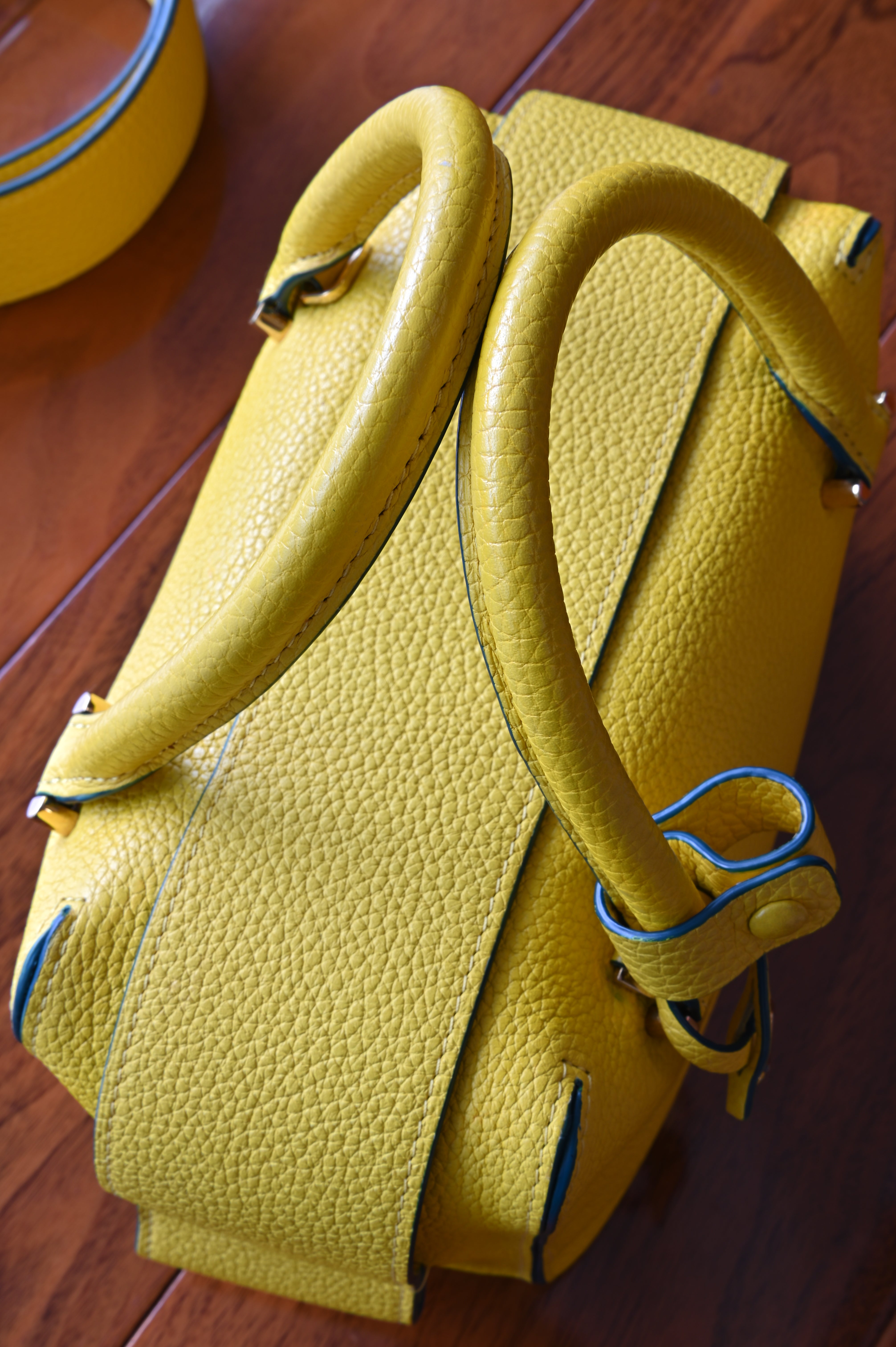 Delvaux Yellow Cool Box Nano Bag handle