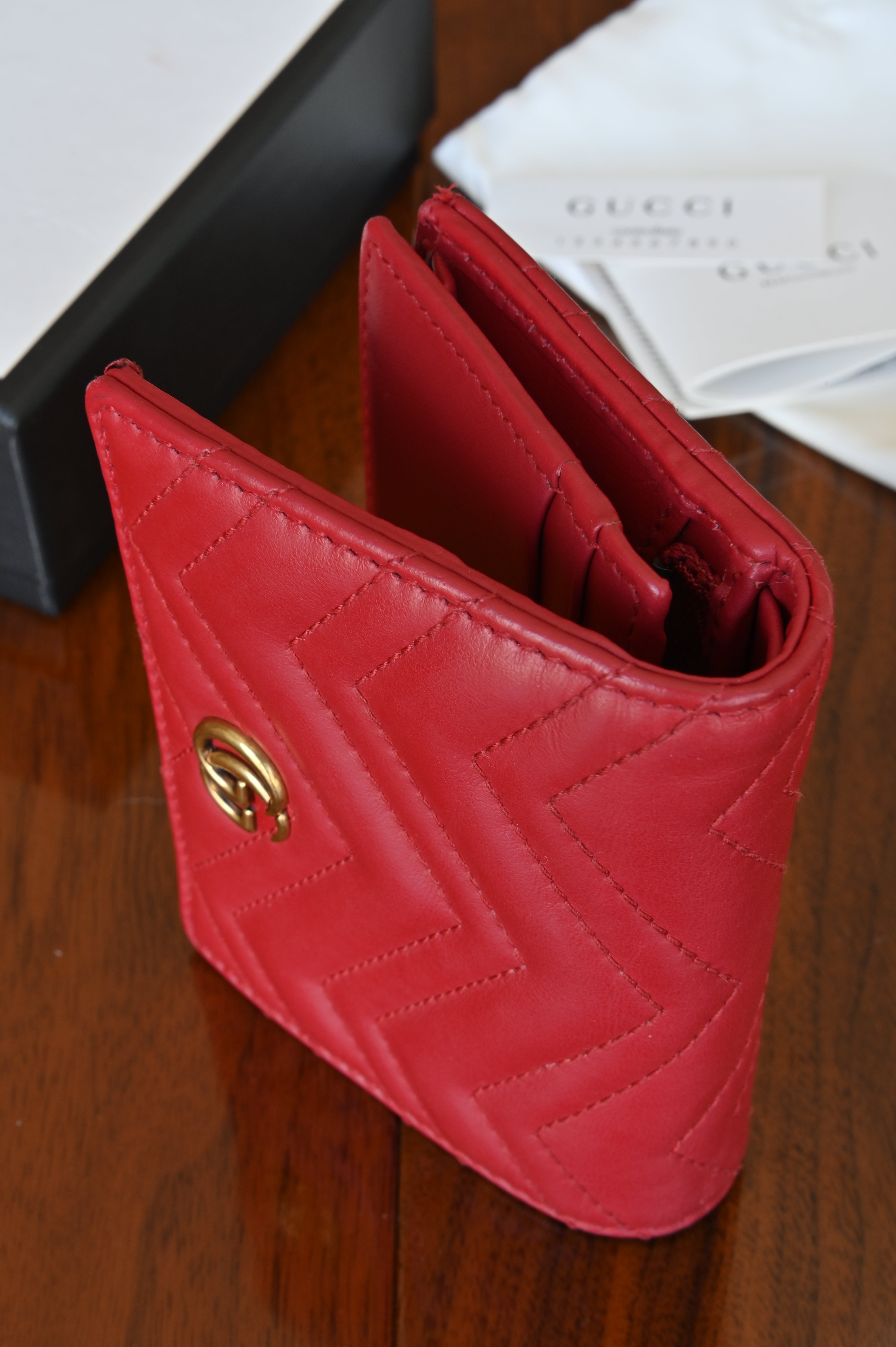Gucci Red Quilted Compact Wallet in Gold left