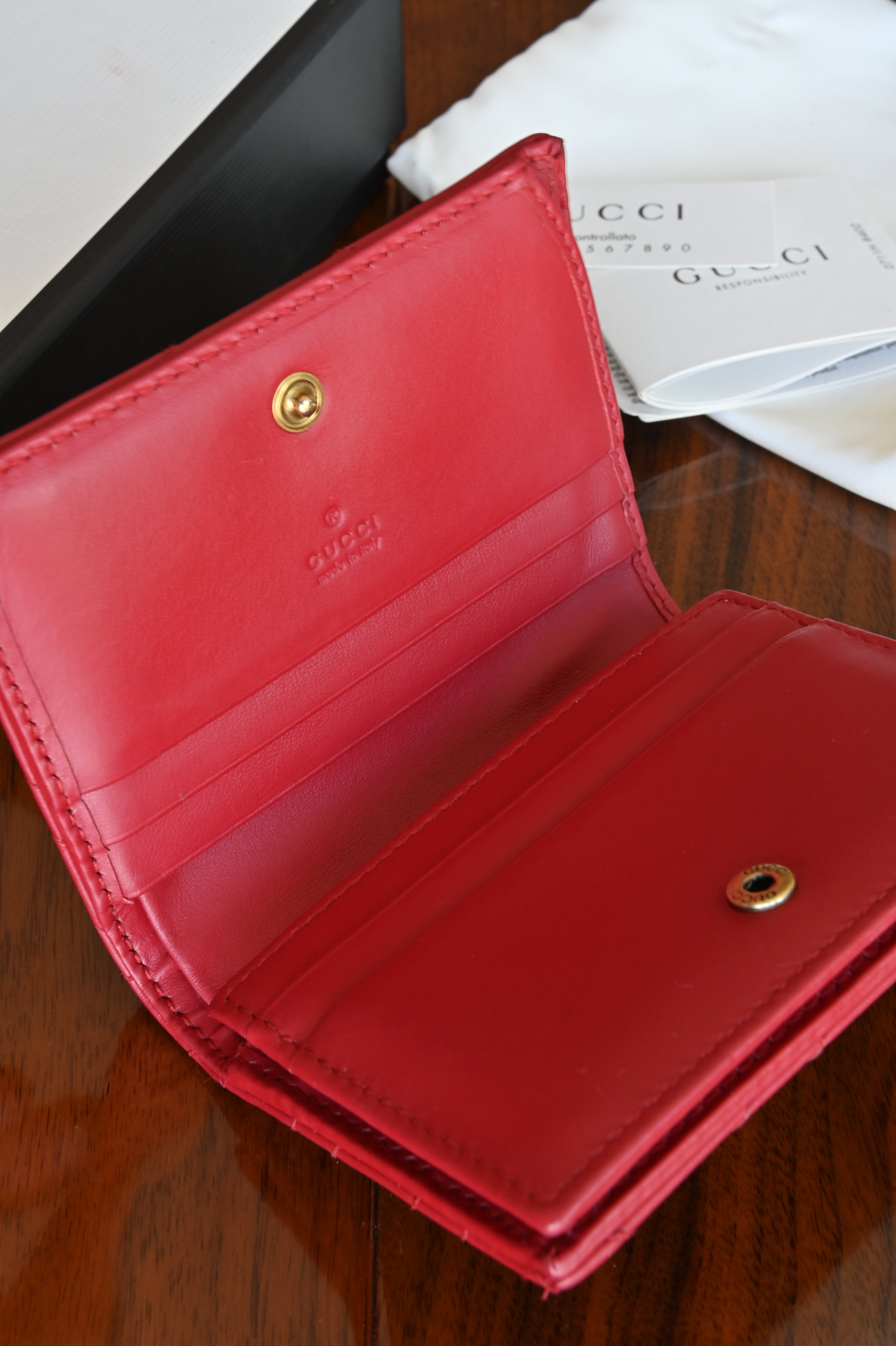 Gucci Red Quilted Compact Wallet in Gold  open
