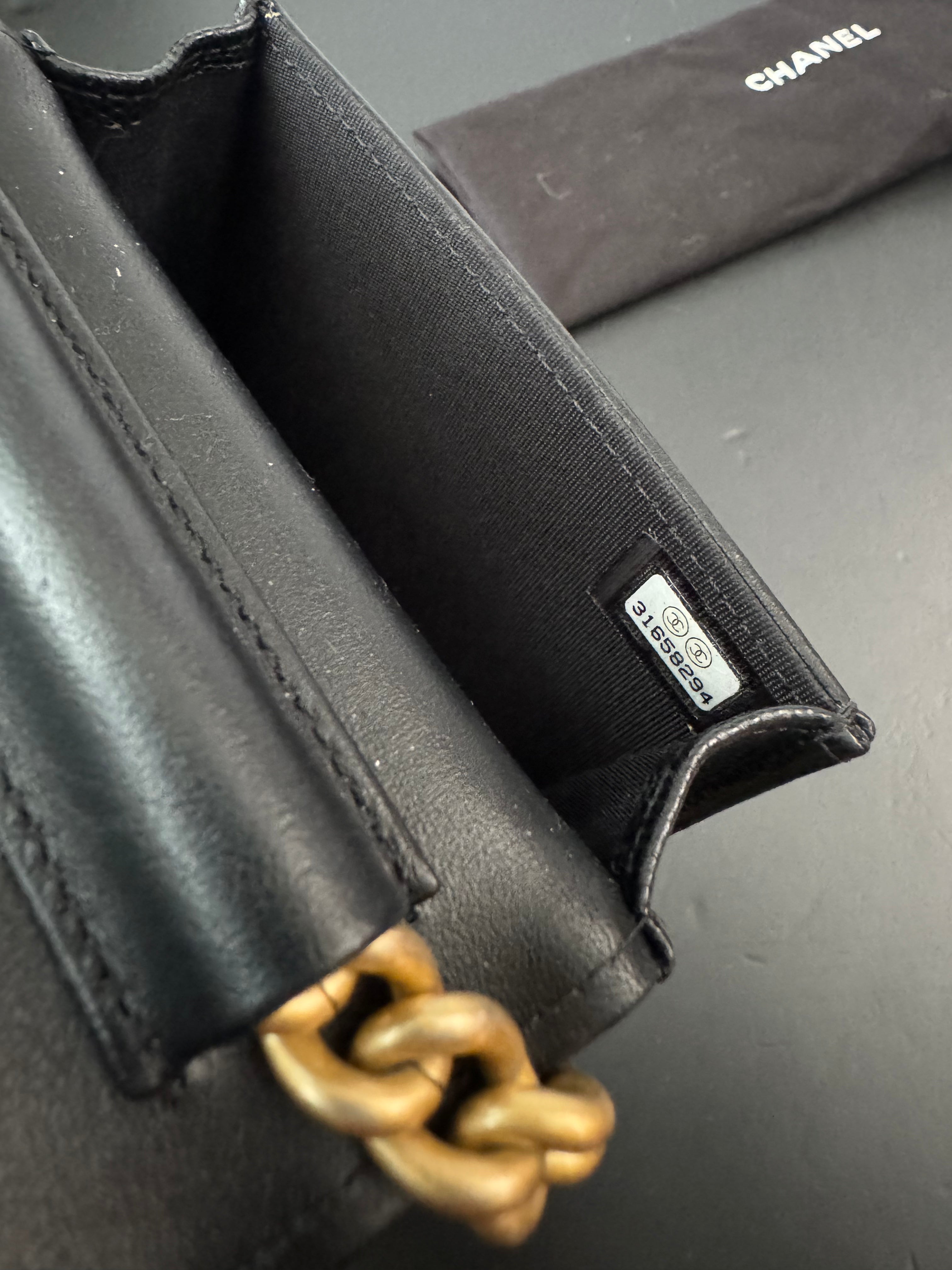 Chanel Boy flap belt bag in caviar leather and gold hardware
