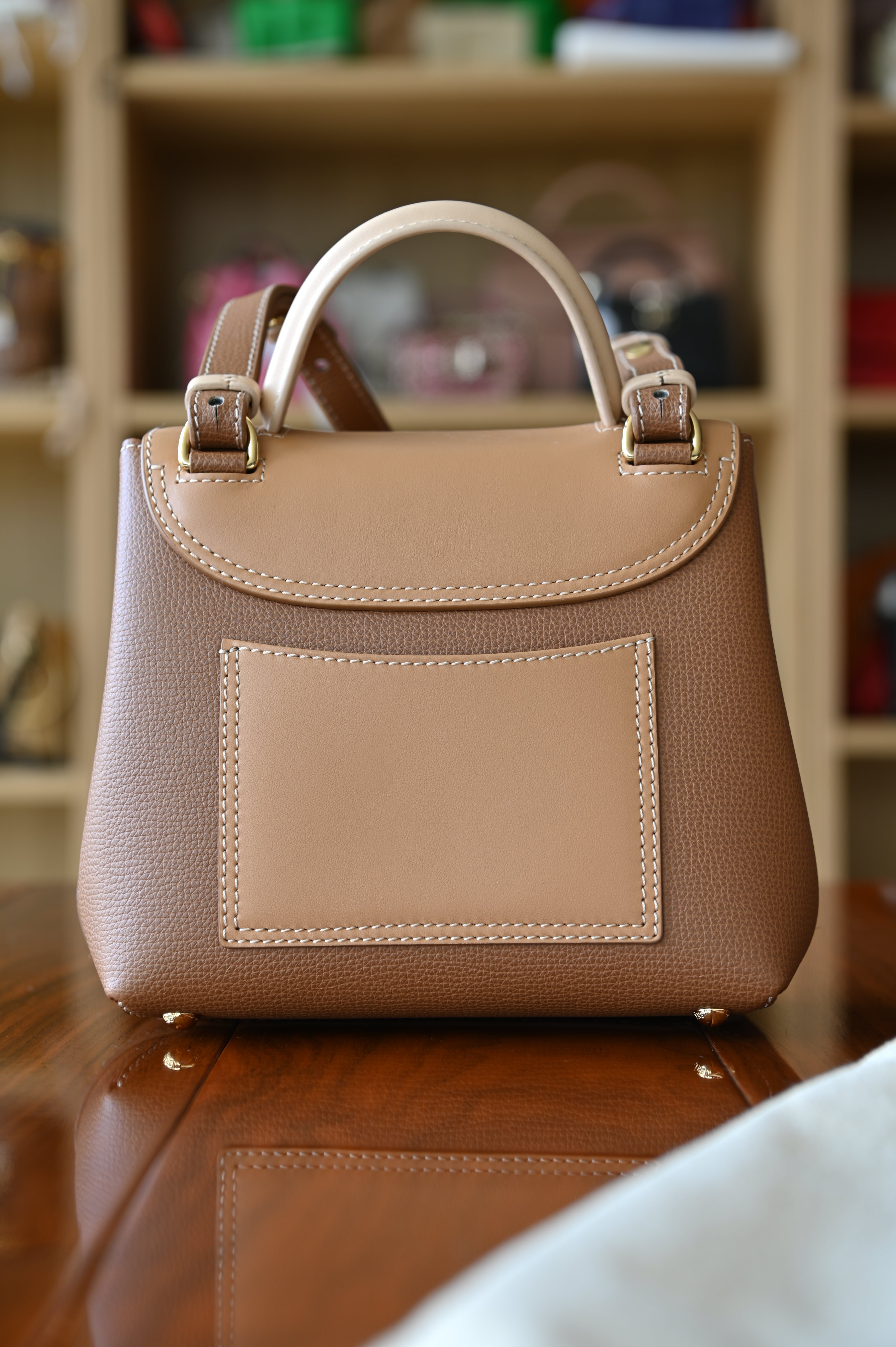 Authentic preloved Polène Numéro Un Nano Bag in Trio Camel, back view with smooth leather detailing and minimalist design.