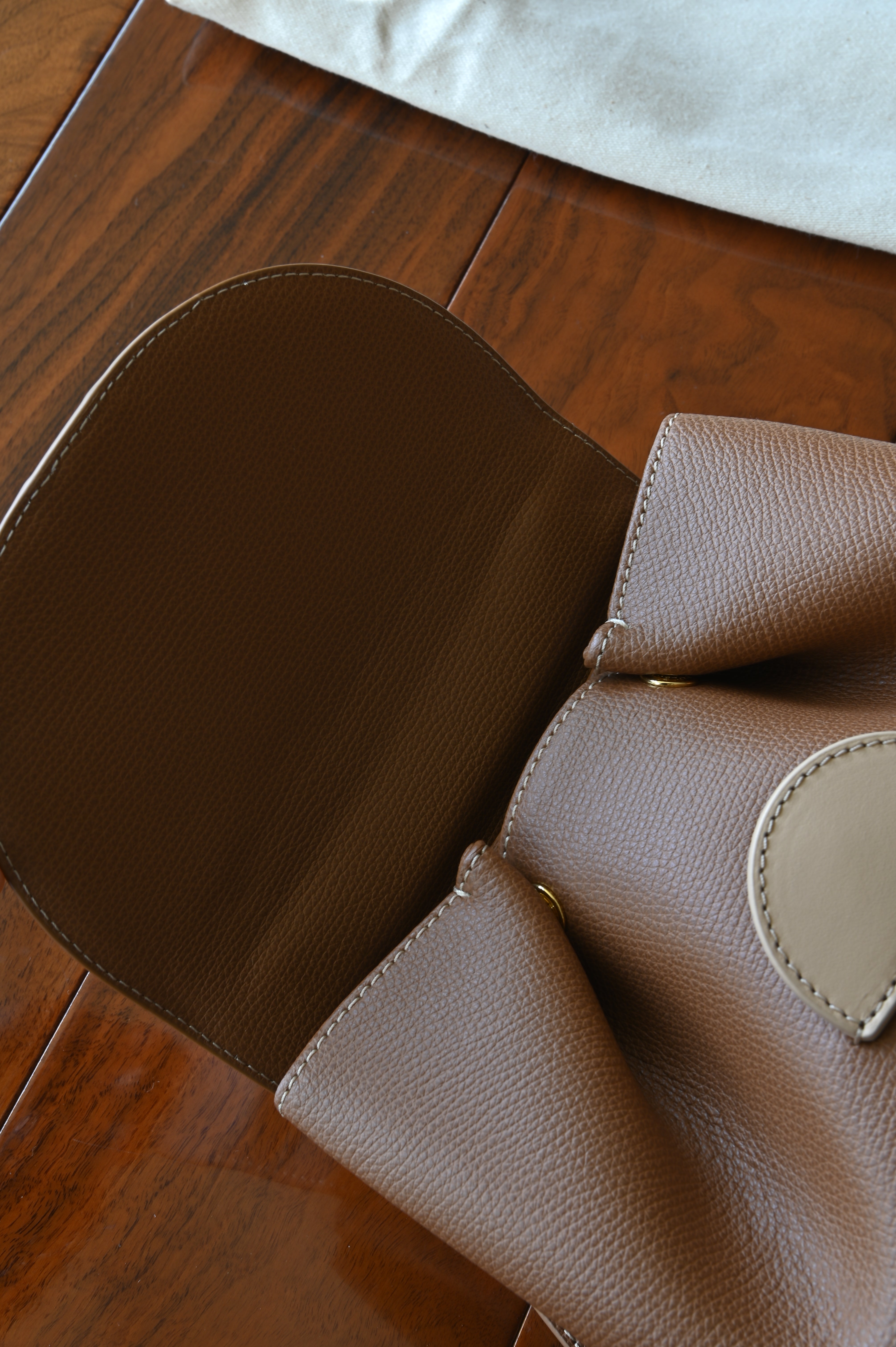 Authentic preloved Polène Numéro Un Nano Bag in Trio Camel, interior view showcasing the leather-lined compartment and storage space.