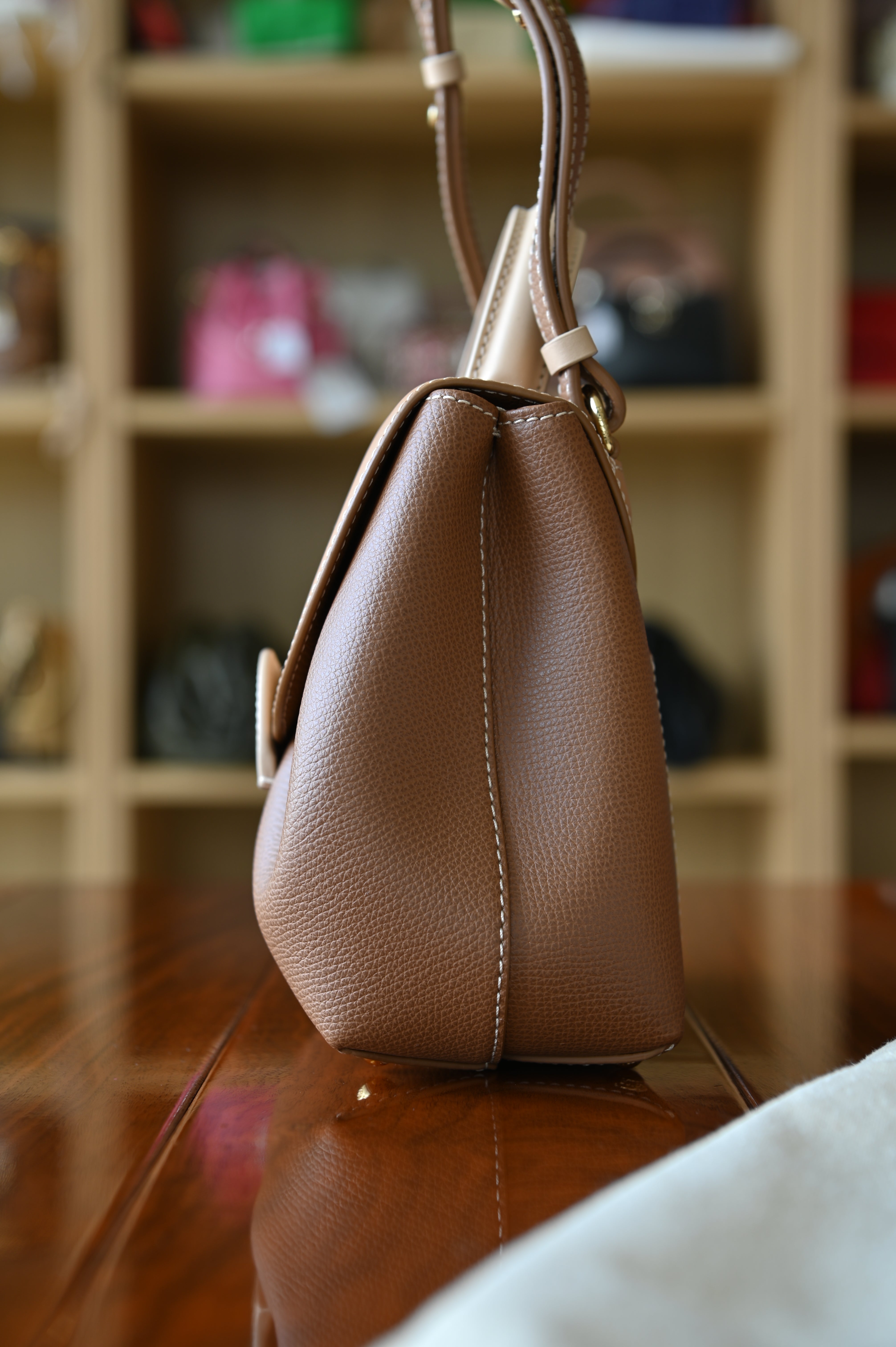 Authentic preloved Polène Numéro Un Nano Bag in Trio Camel, side profile displaying its compact silhouette and refined construction.