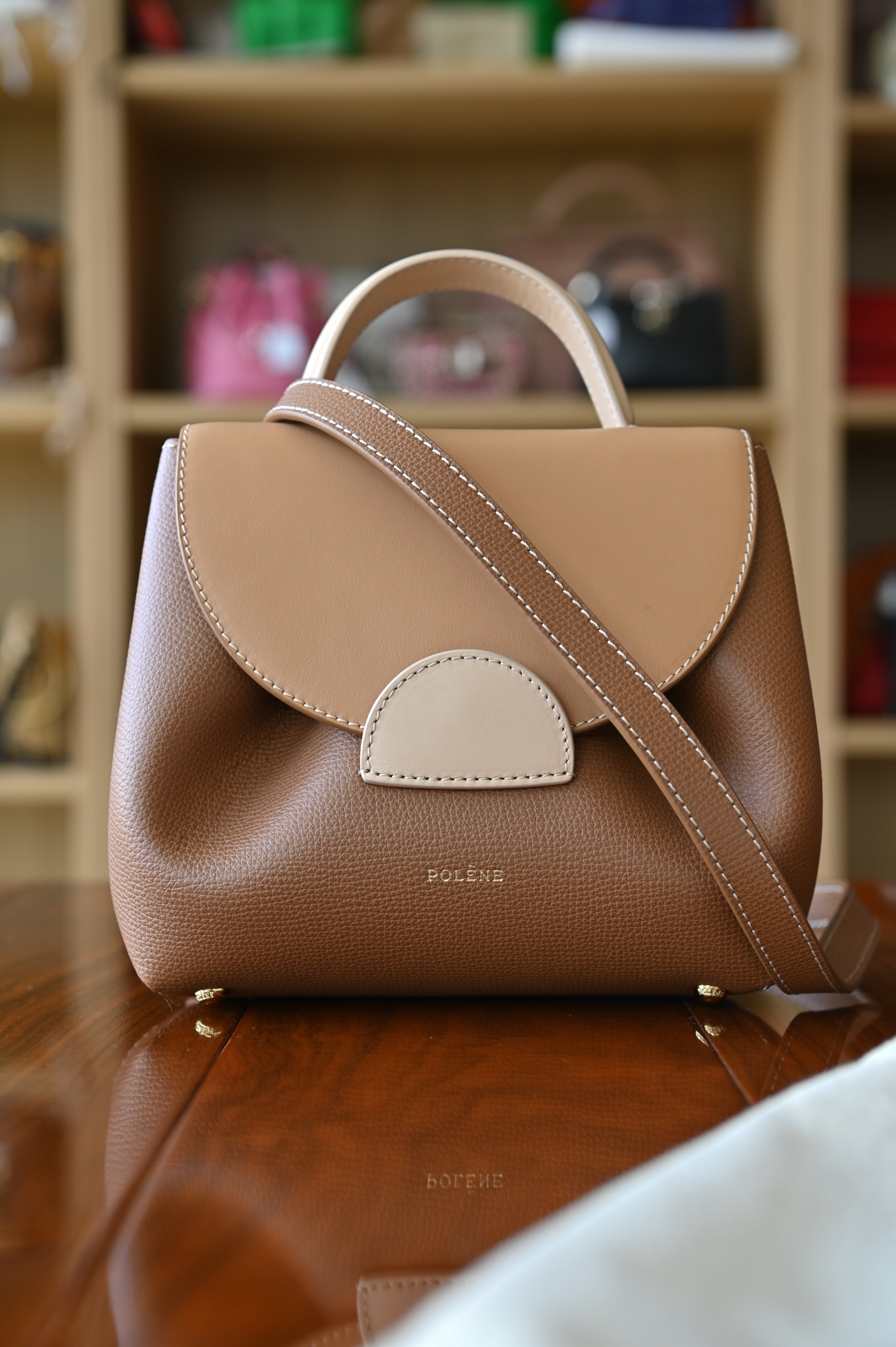 Authentic preloved Polène Numéro Un Nano Bag in Trio Camel featuring a sculpted leather silhouette, curved flap design, and signature gold-tone hardware. with long strap