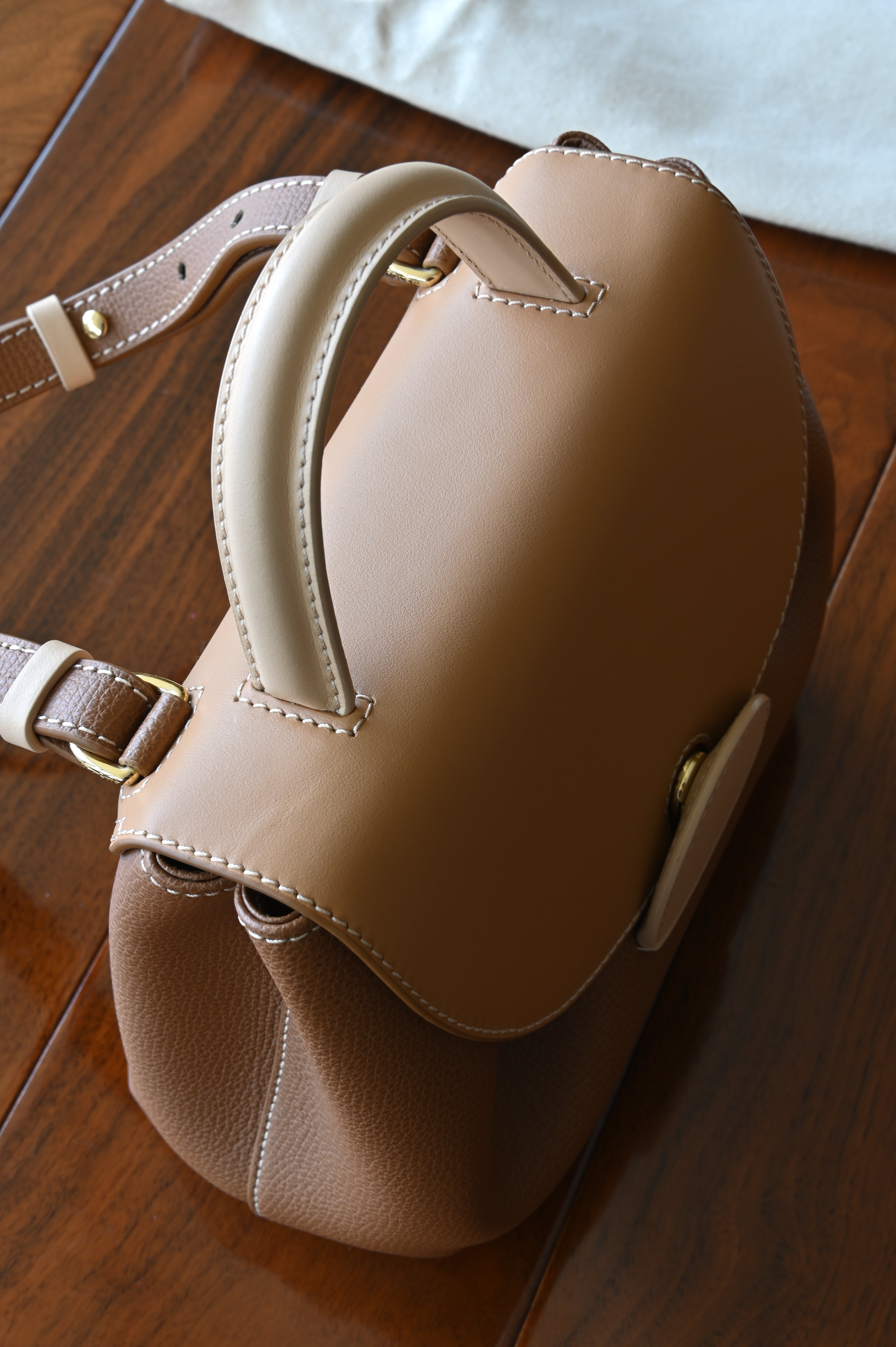 Authentic preloved Polène Numéro Un Nano Bag in Trio Camel featuring an adjustable shoulder strap and premium leather finish.