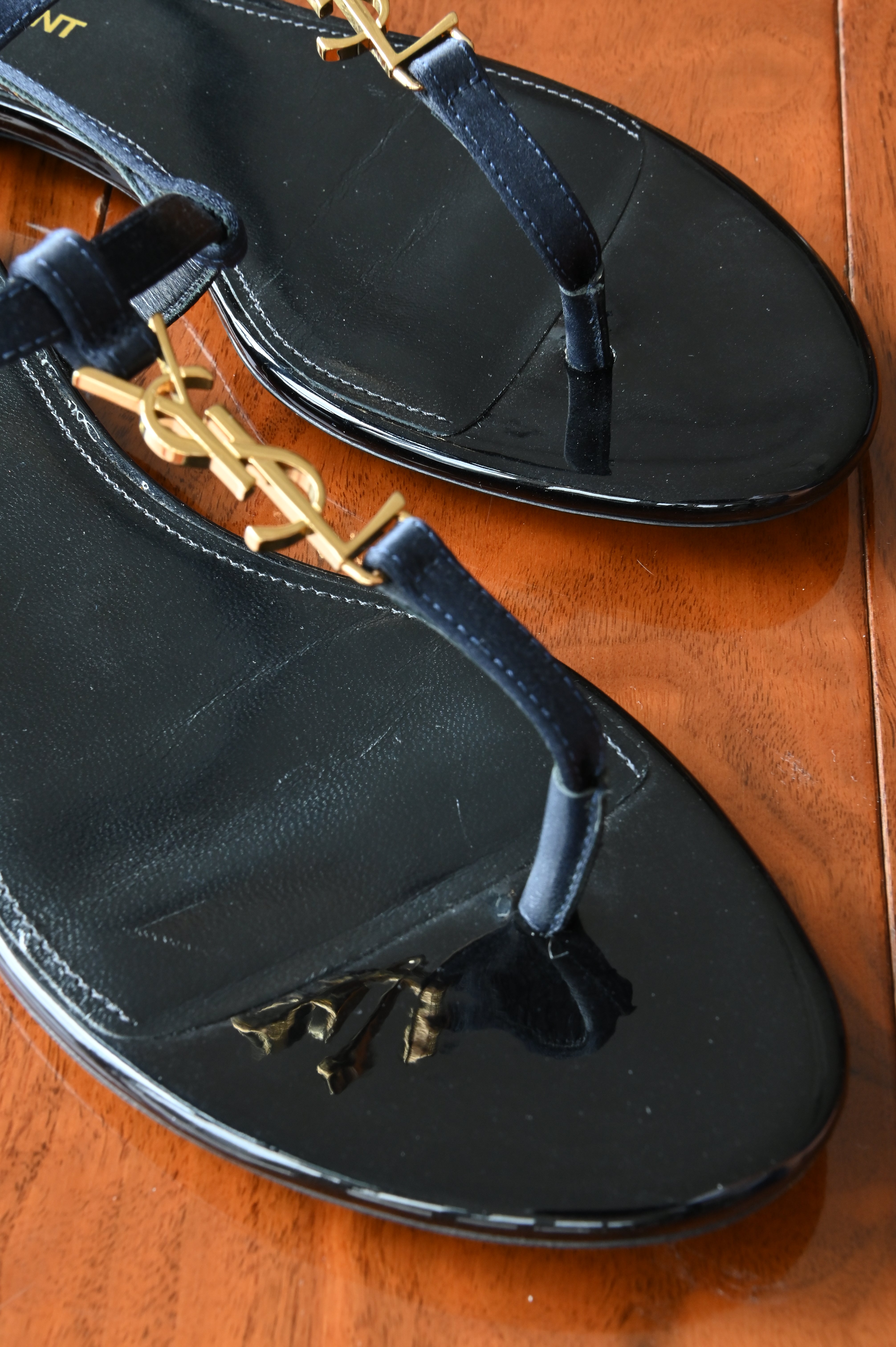 Saint Laurent Black Patent Cassandra Sandals front