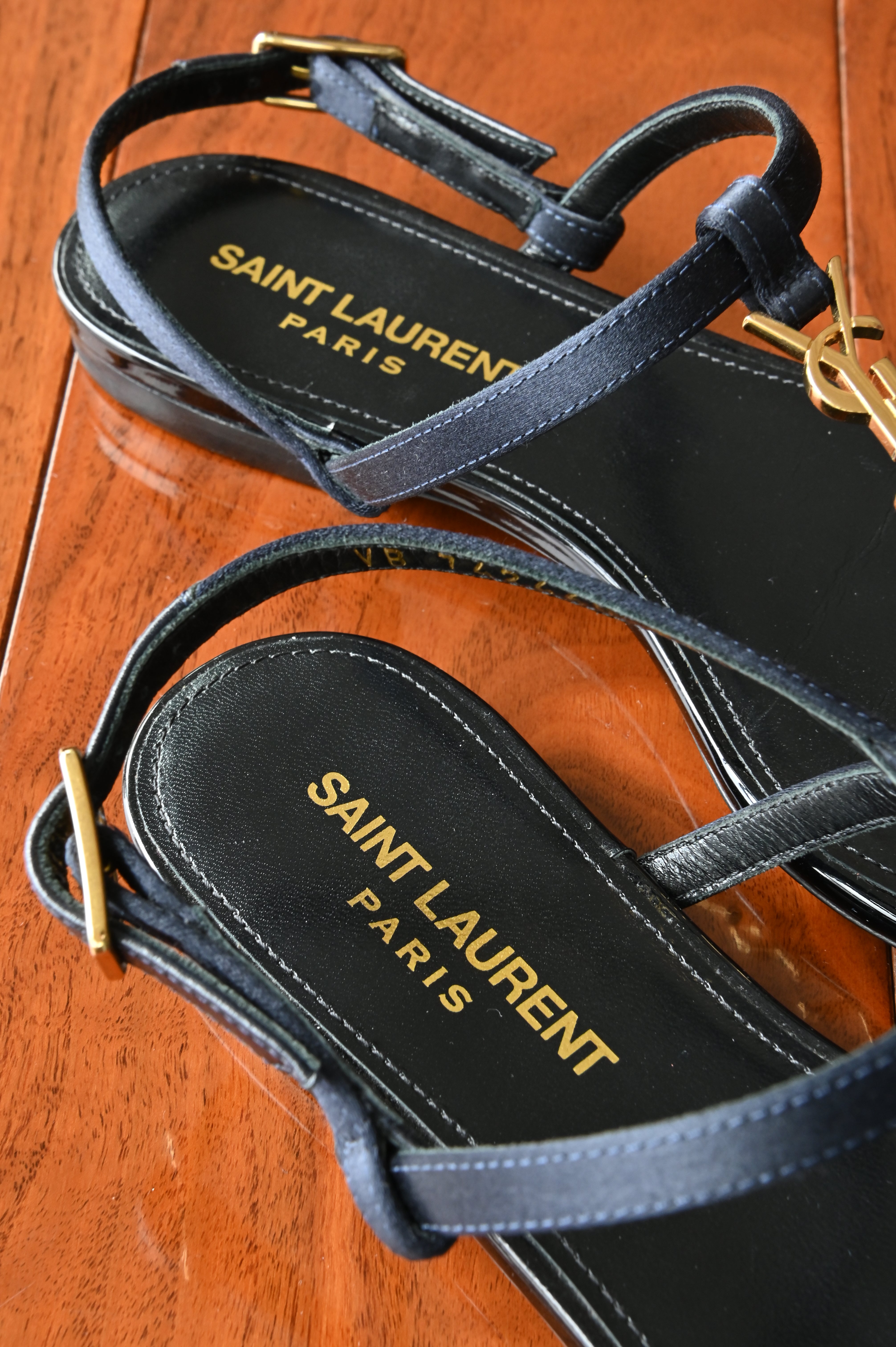 Saint Laurent Black Patent Cassandra Sandals logo