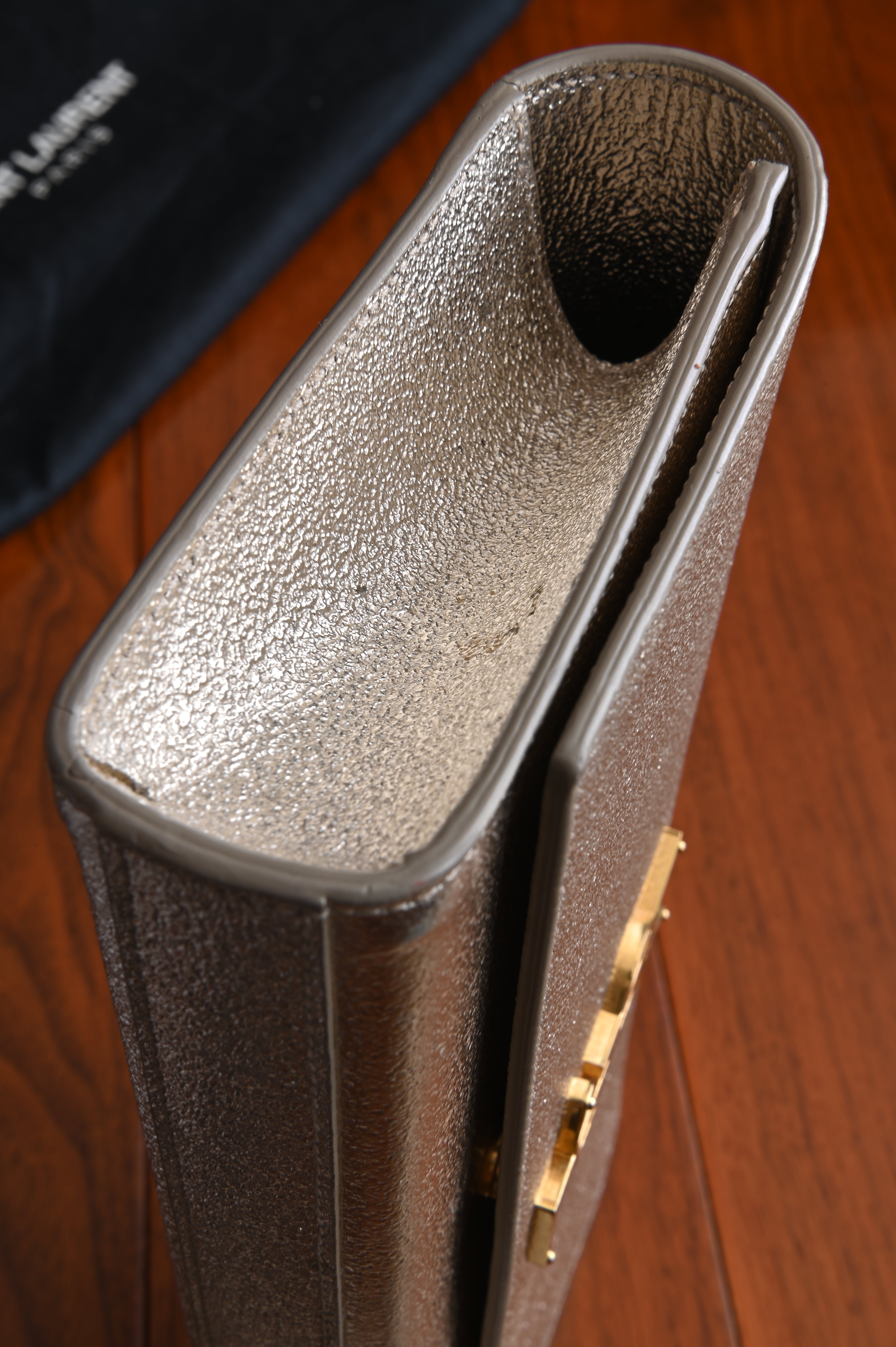 Saint Laurent Metallic Gold clutch left