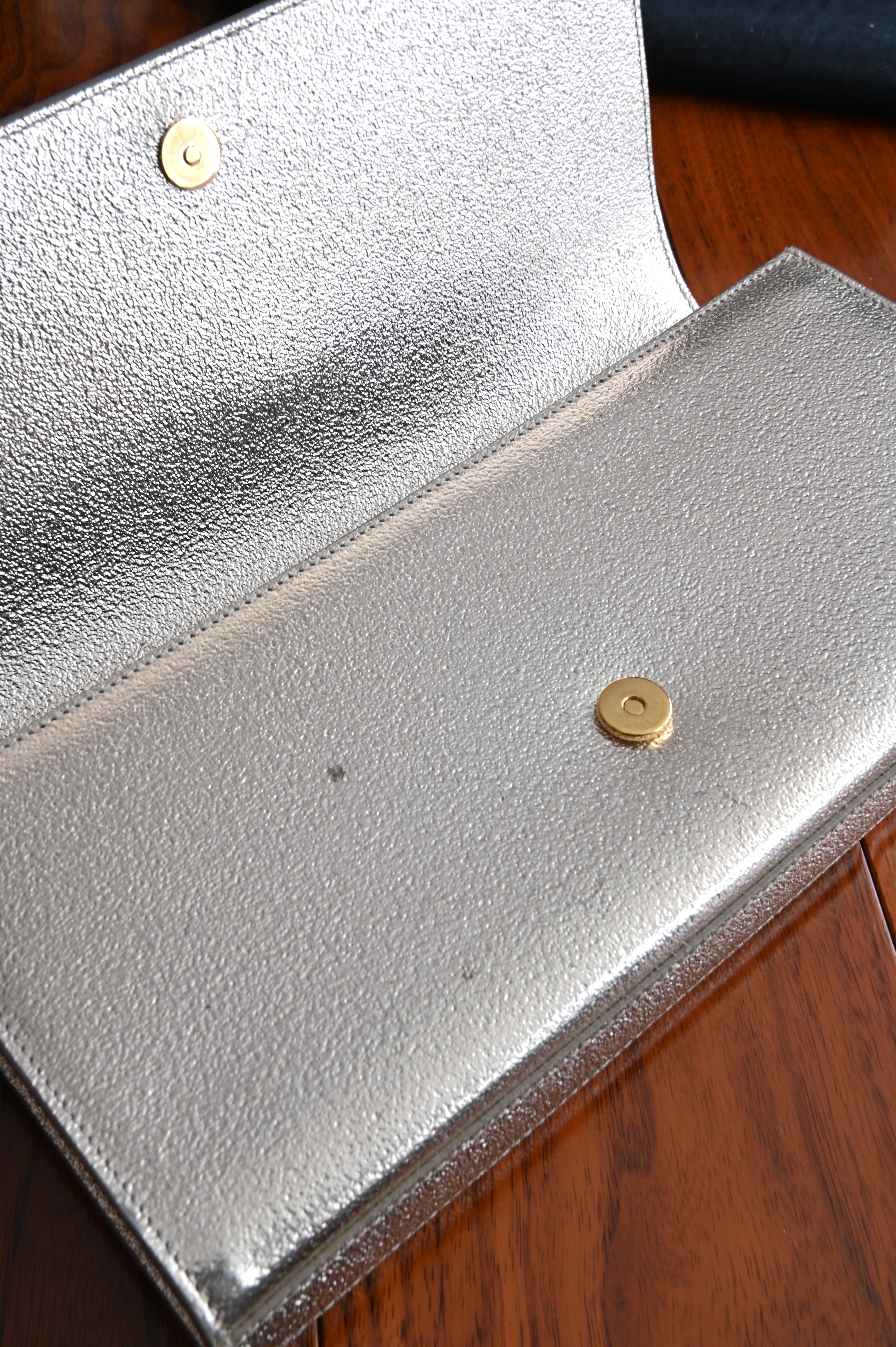 Saint Laurent Metallic Gold clutch open