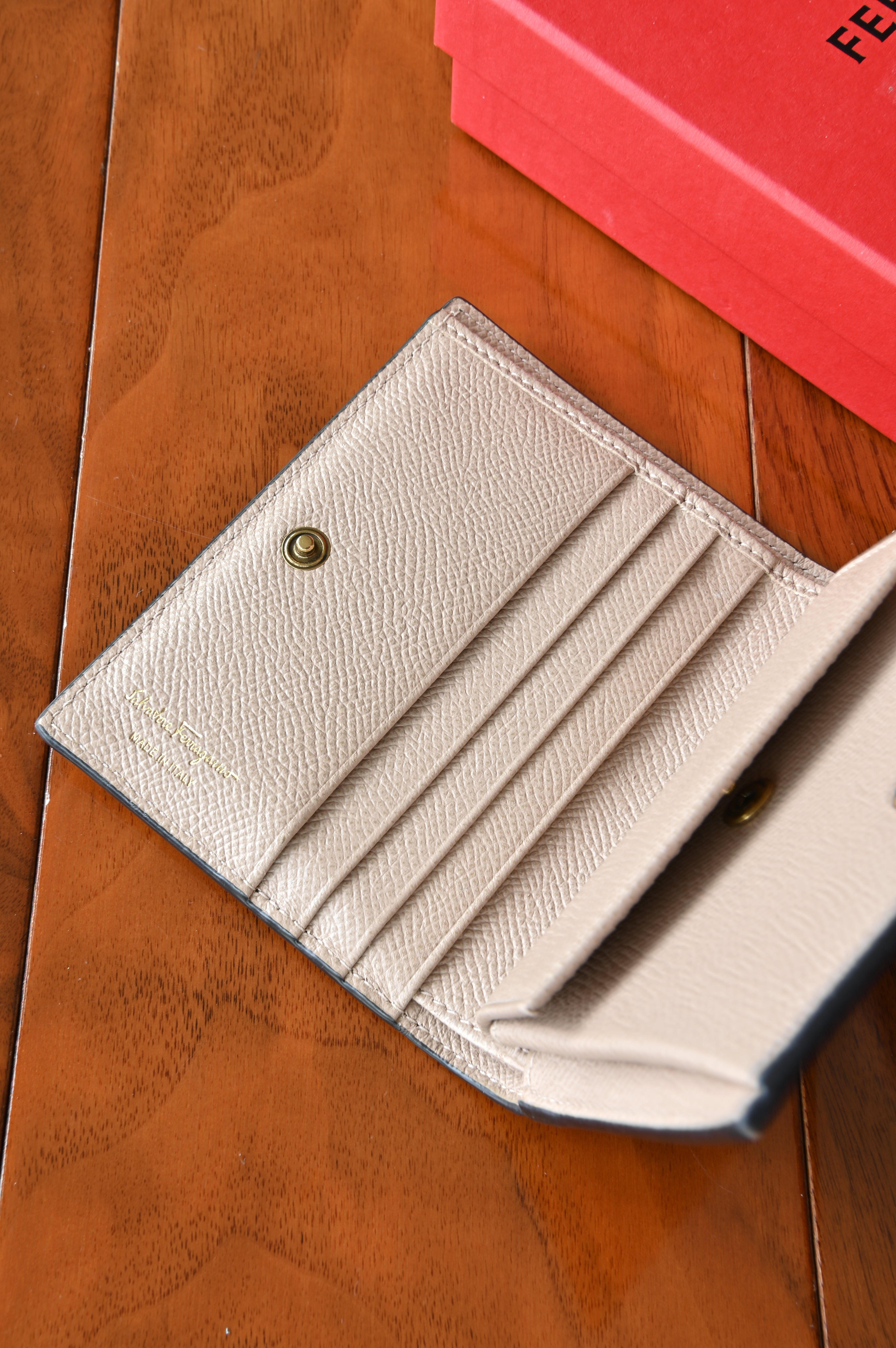 Salvatore Ferragamo Beige Gancini Compact Wallet logo