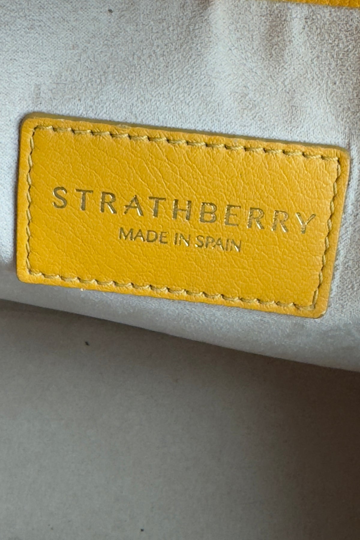 Strathberry Yellow Mustard Top Handle Bag logo