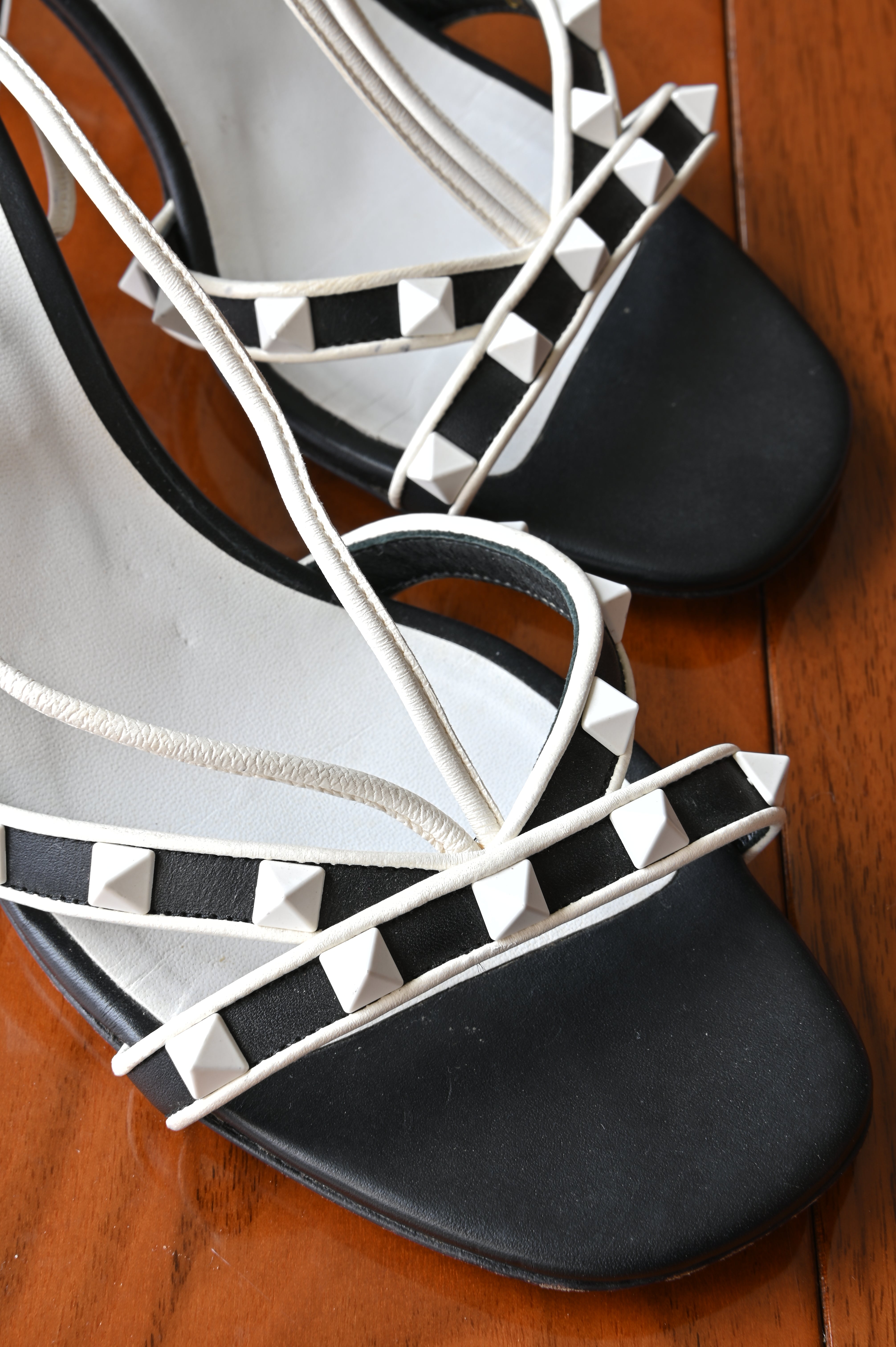 Valentino Garavani Black White Rockstud Cage Sandals front