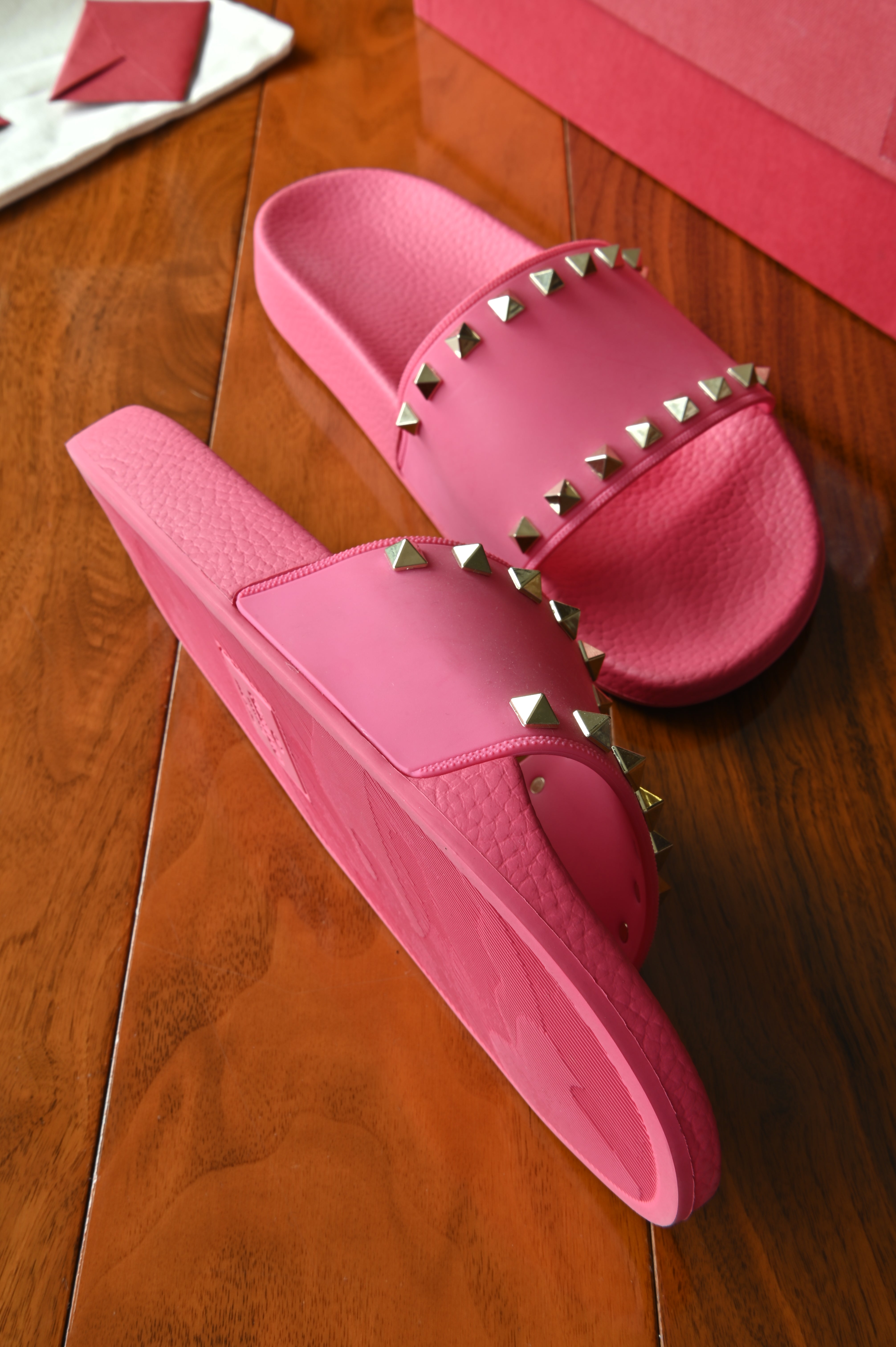 Valentino Garavani Pink Rockstud Rubber Slippers left