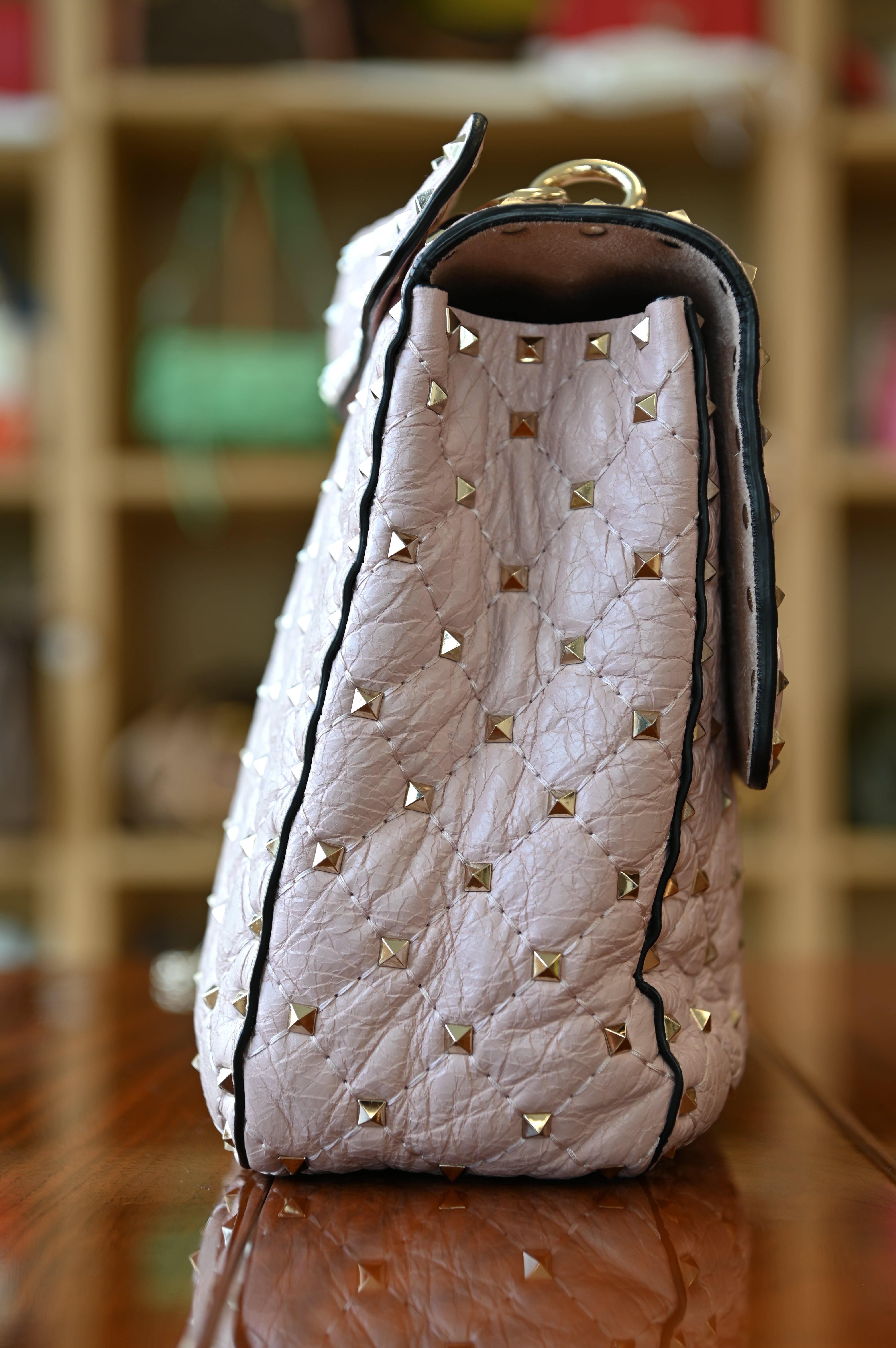 Preloved Valentino Garavani Pink Rockstud Shoulder Bag in blush pink leather featuring signature gold-tone Rockstud embellishments, structured silhouette, adjustable shoulder strap, and elegant luxury design