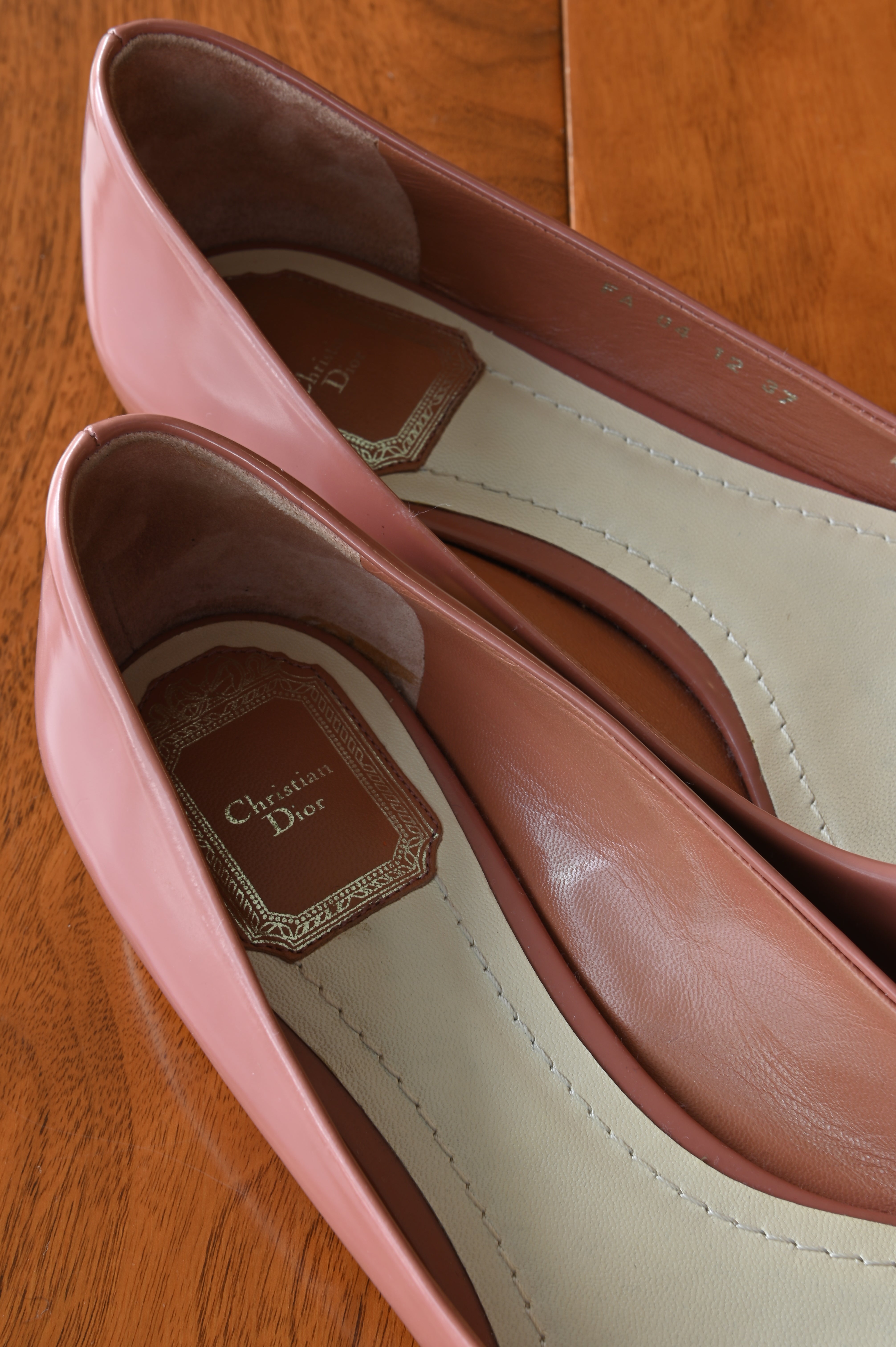 Close-up of the authentic Christian Dior Dusty Rose Patent Ballet Flats interior showing the leather lining and branded insole.