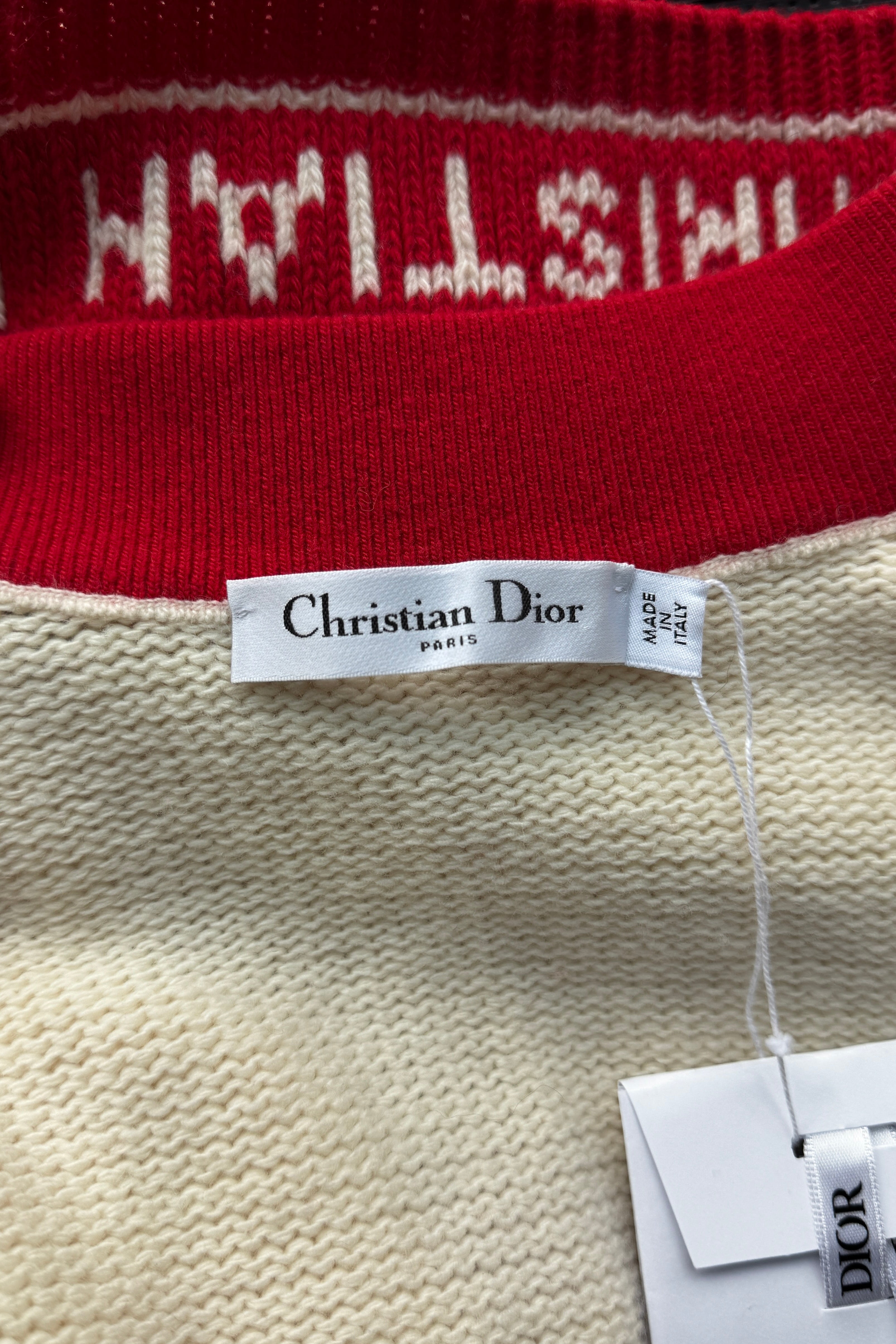 Close-up of the authentic Christian Dior brand label stitched inside the White & Red Knit Cardigan.