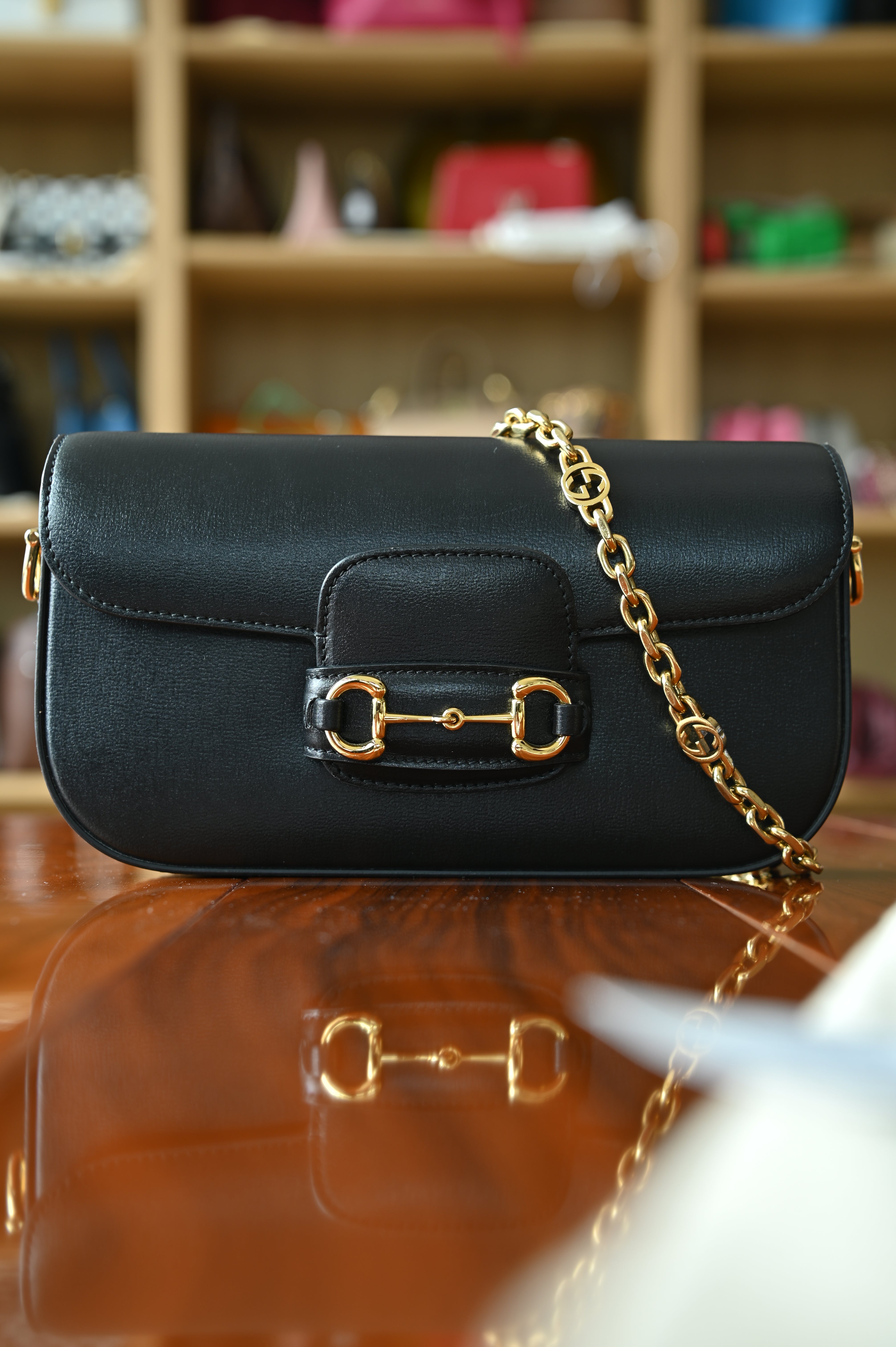 Authentic Gucci Horsebit 1955 Mini Shoulder Bag in black smooth leather with iconic gold-tone Horsebit hardware and detachable chain strap.