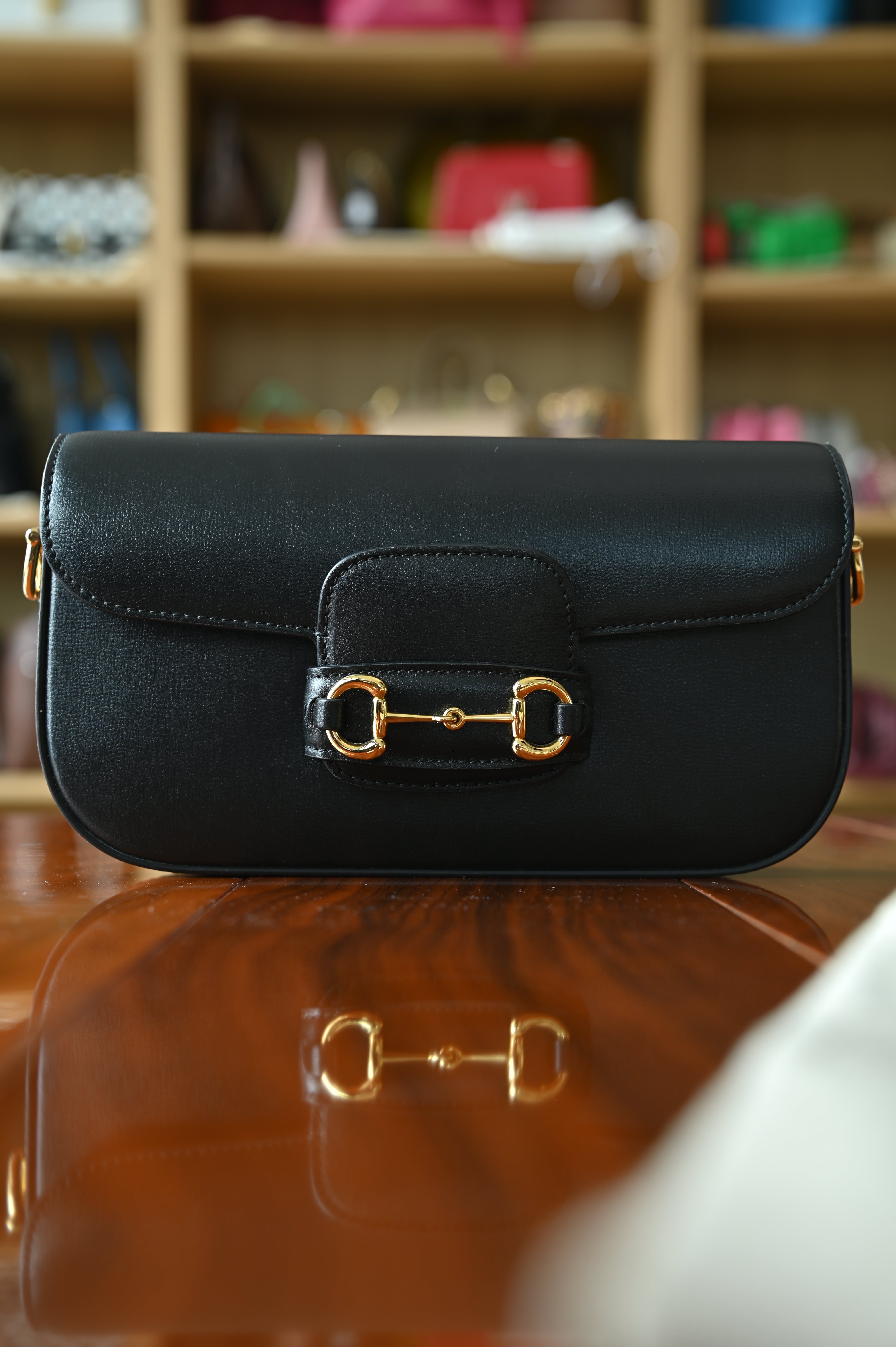 Front view of the authentic Gucci Horsebit 1955 Mini Shoulder Bag in black smooth leather with signature Horsebit detail.