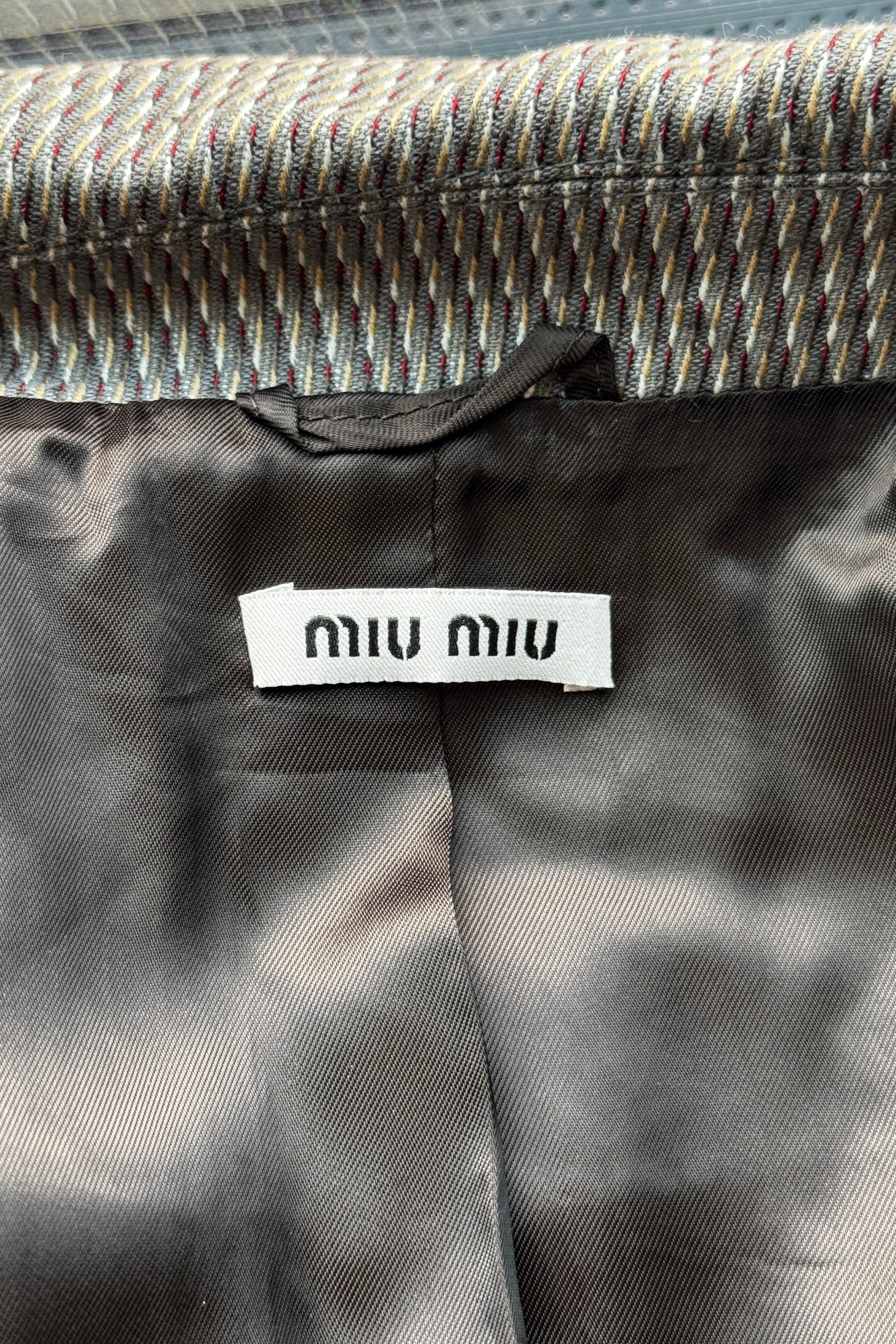 Authentic Miu Miu Grey Checked Two-Piece Skirt Suit featuring the original Miu Miu brand label.
