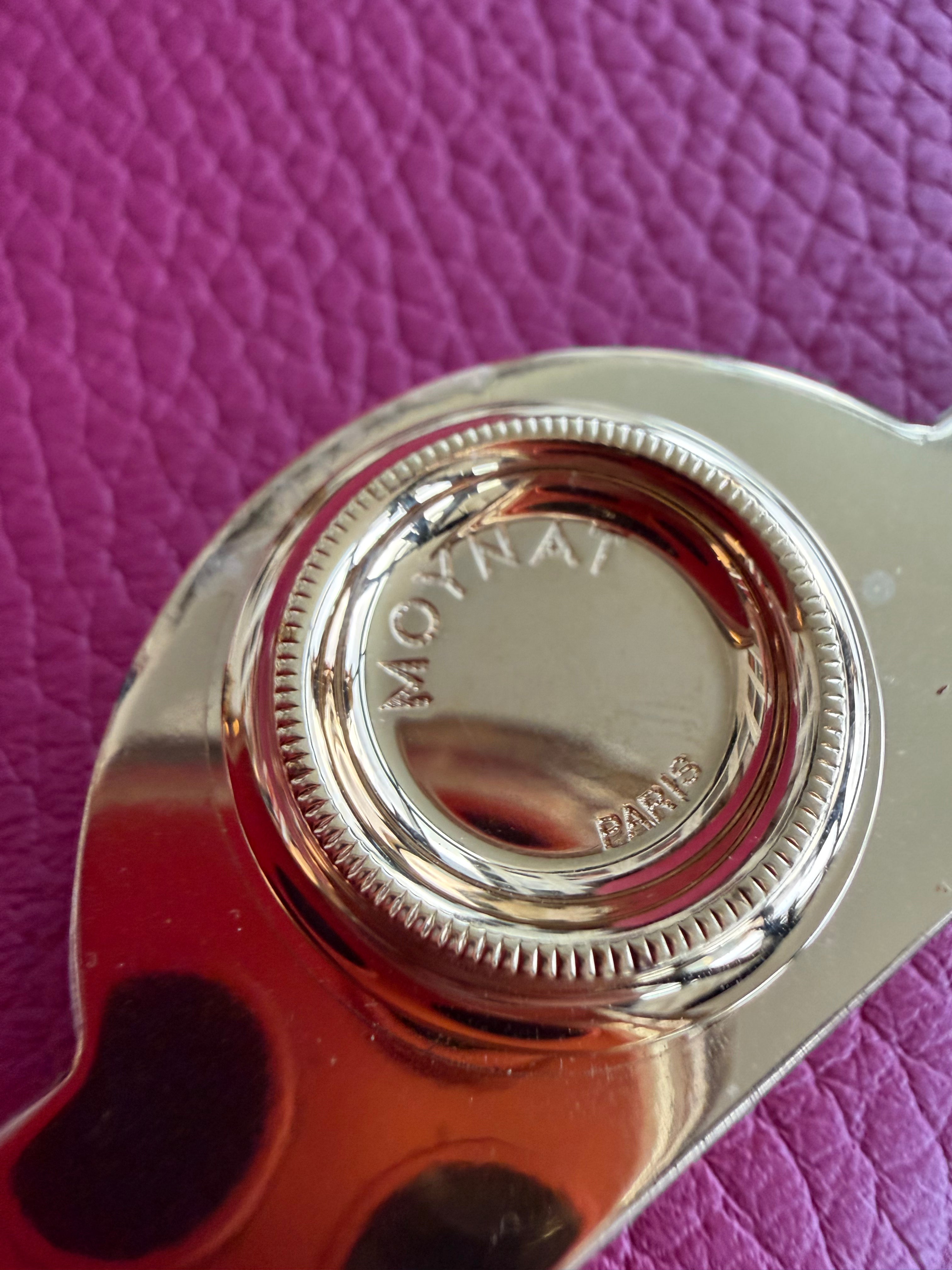 Authentic preloved Moynat Rejane BB gold-tone signature closure detail with protective film intact