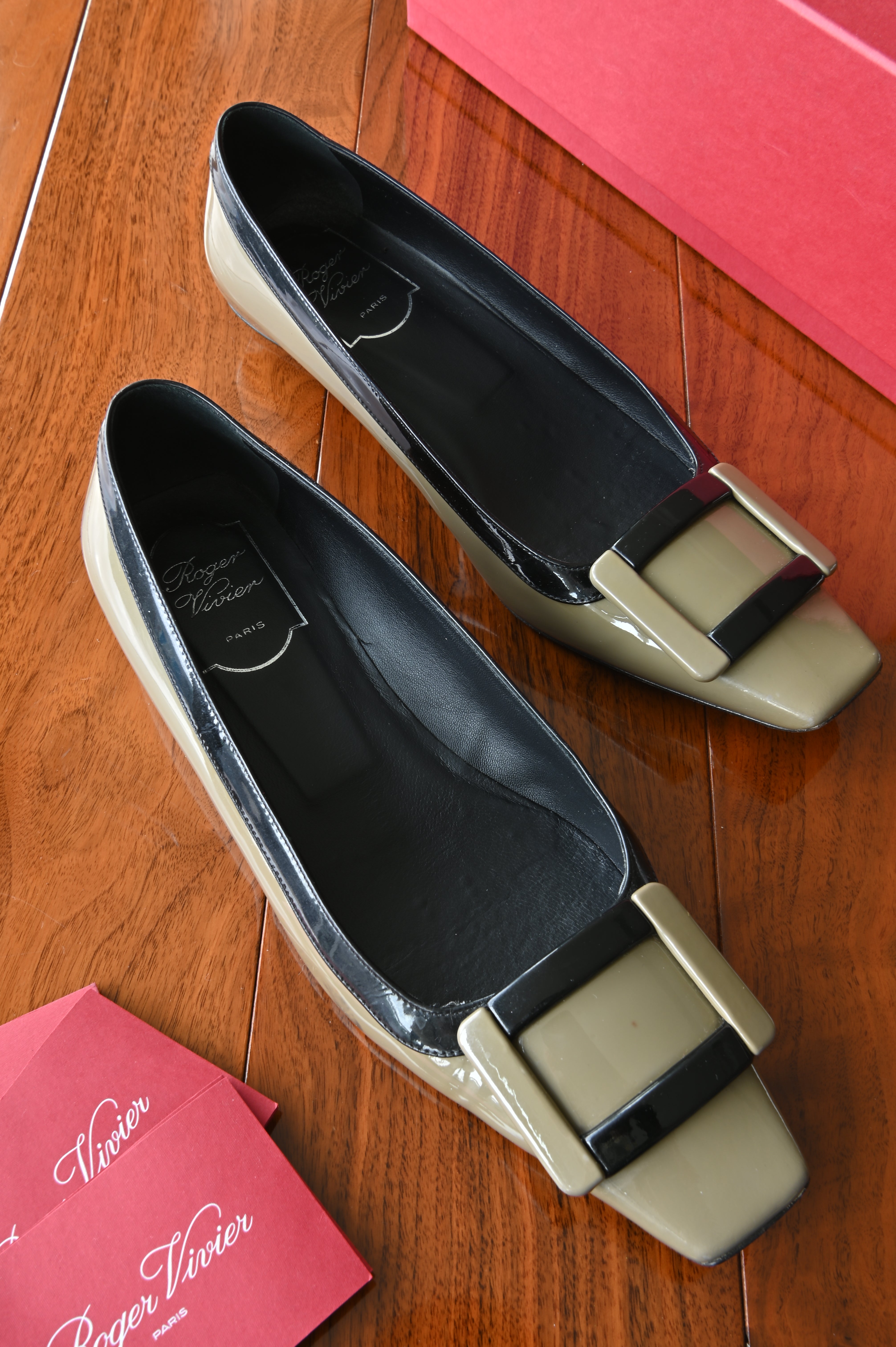 Authentic Roger Vivier Belle Vivier patent leather pumps in taupe with black trim featuring the signature oversized buckle and square-toe silhouette.