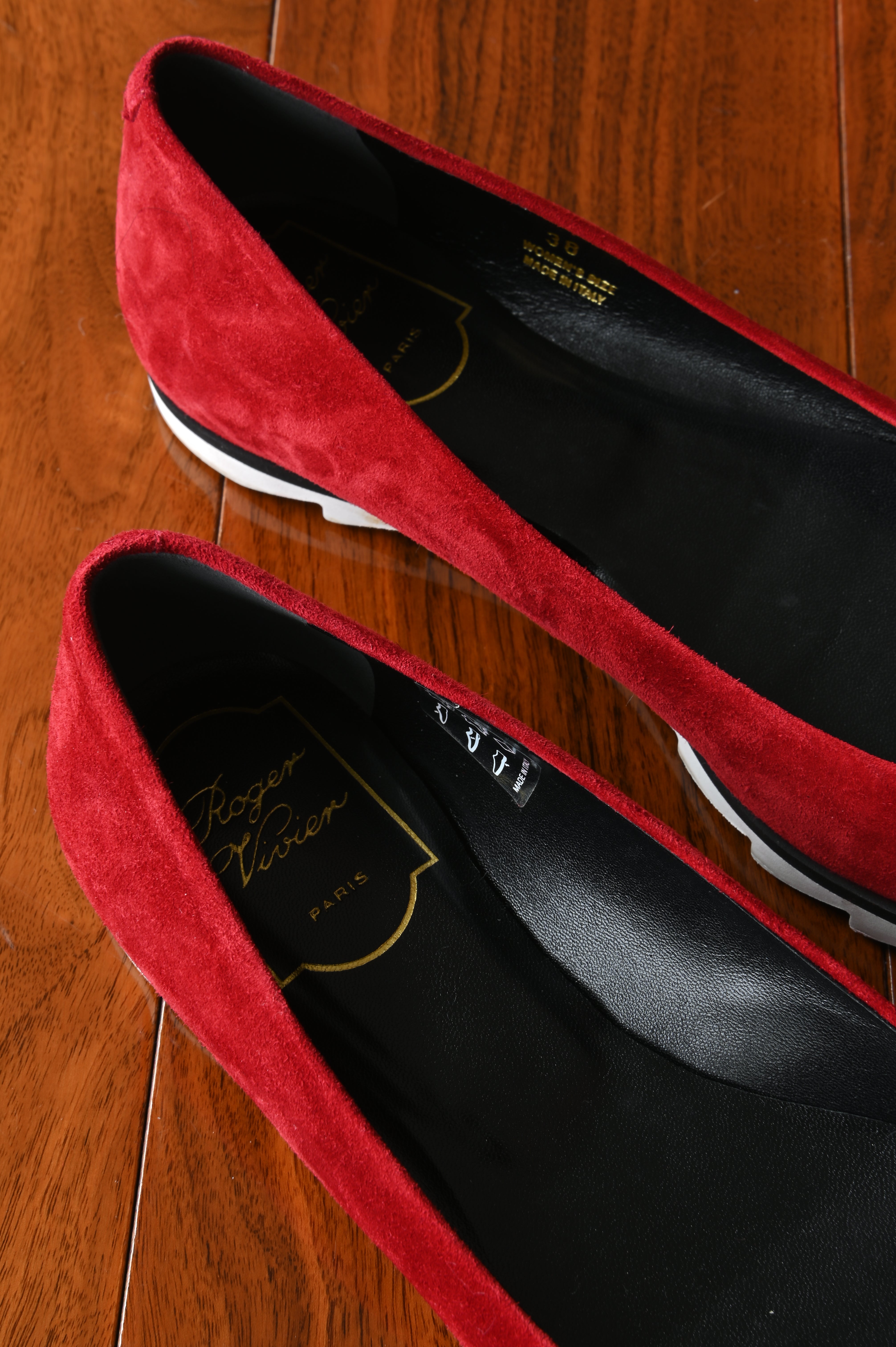 Close-up of the Roger Vivier Paris logo on the black leather footbed, highlighting the craftsmanship and premium materials.