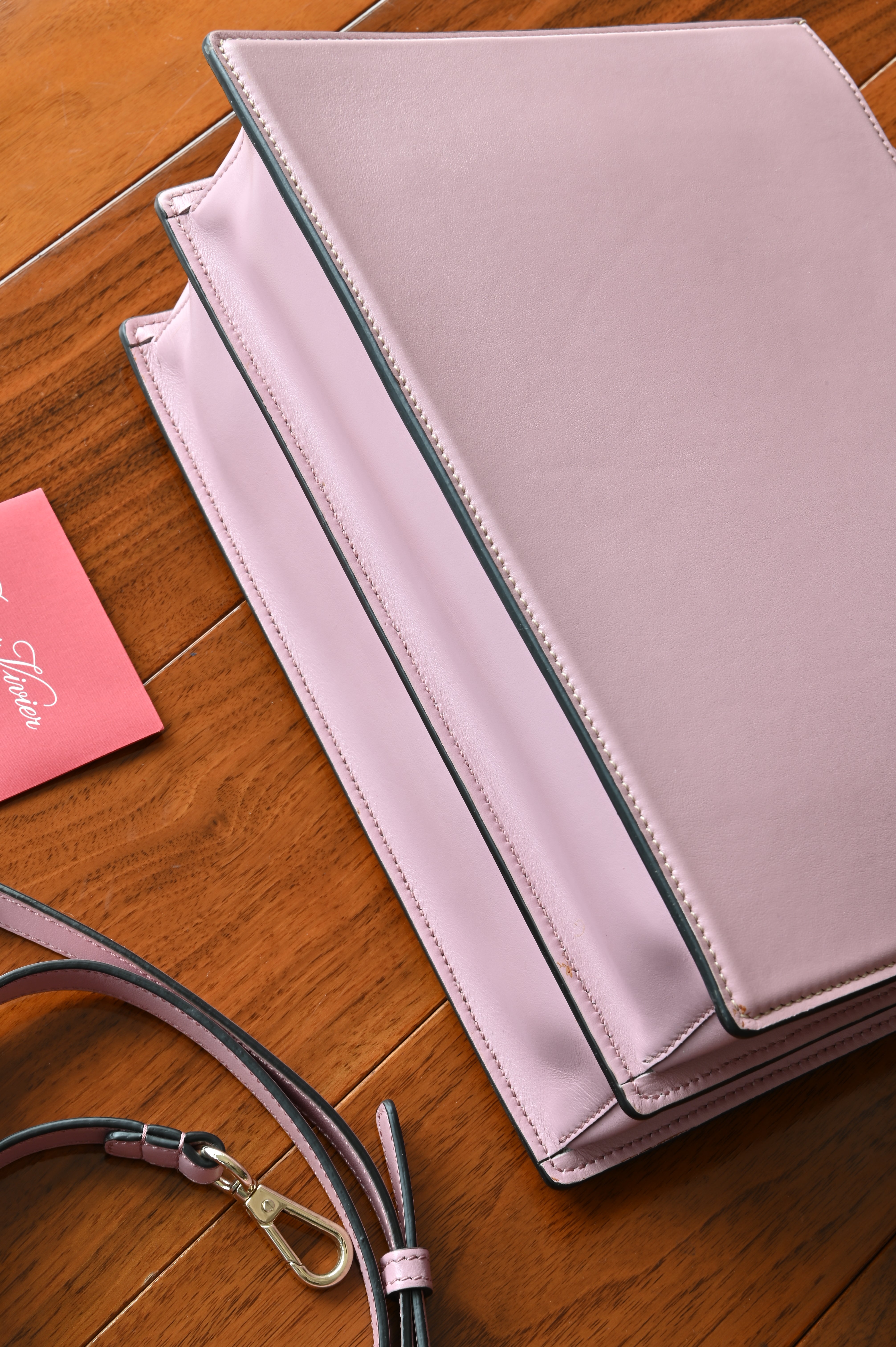 Bottom view of the authentic Roger Vivier Viv’ Cabas Pink Leather Top Handle Bag showing the structured leather base and craftsmanship.
