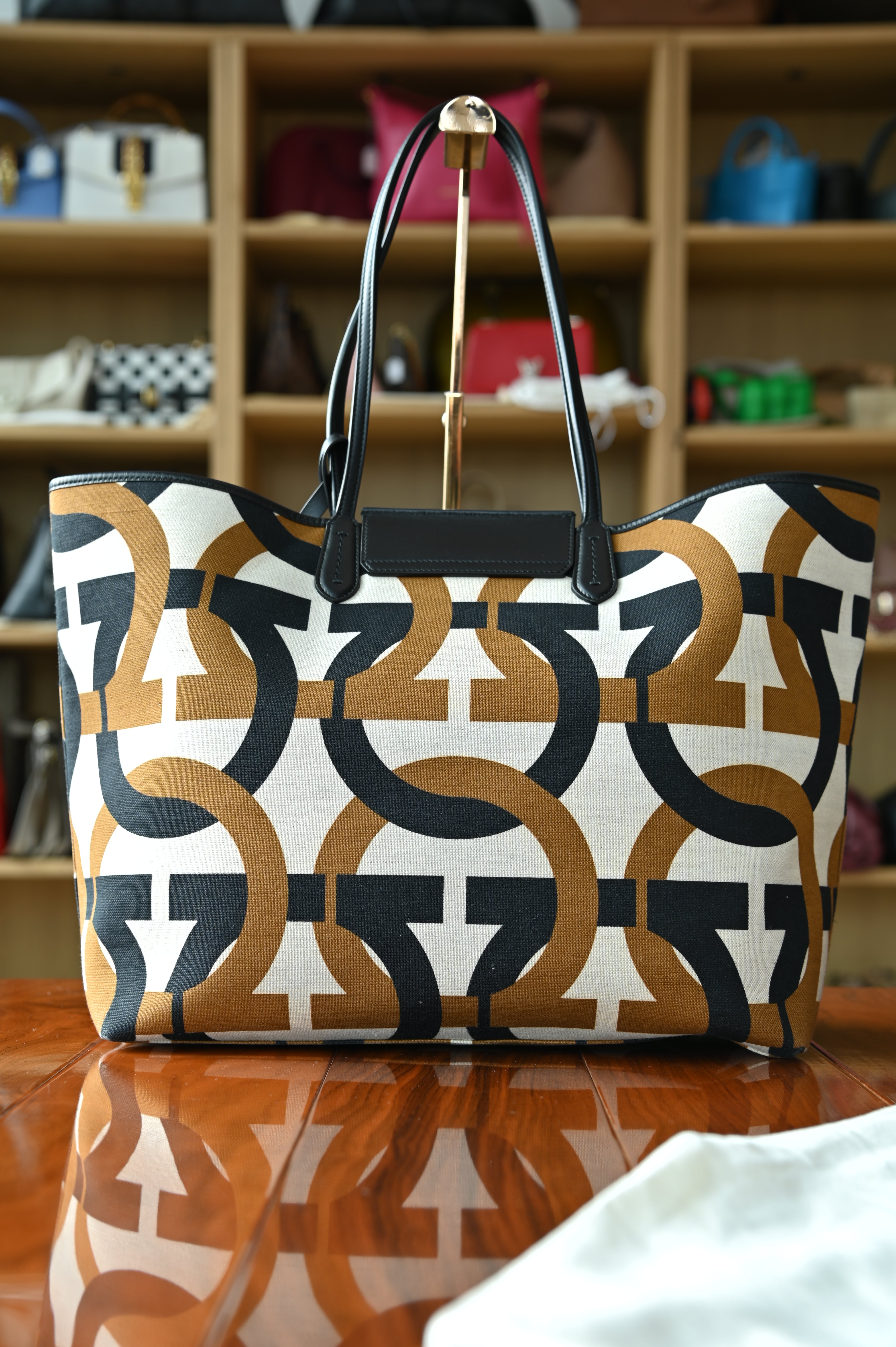 Authentic Salvatore Ferragamo Monogram Canvas Tote Bag showing the rear view with black leather shoulder straps and leather trim.